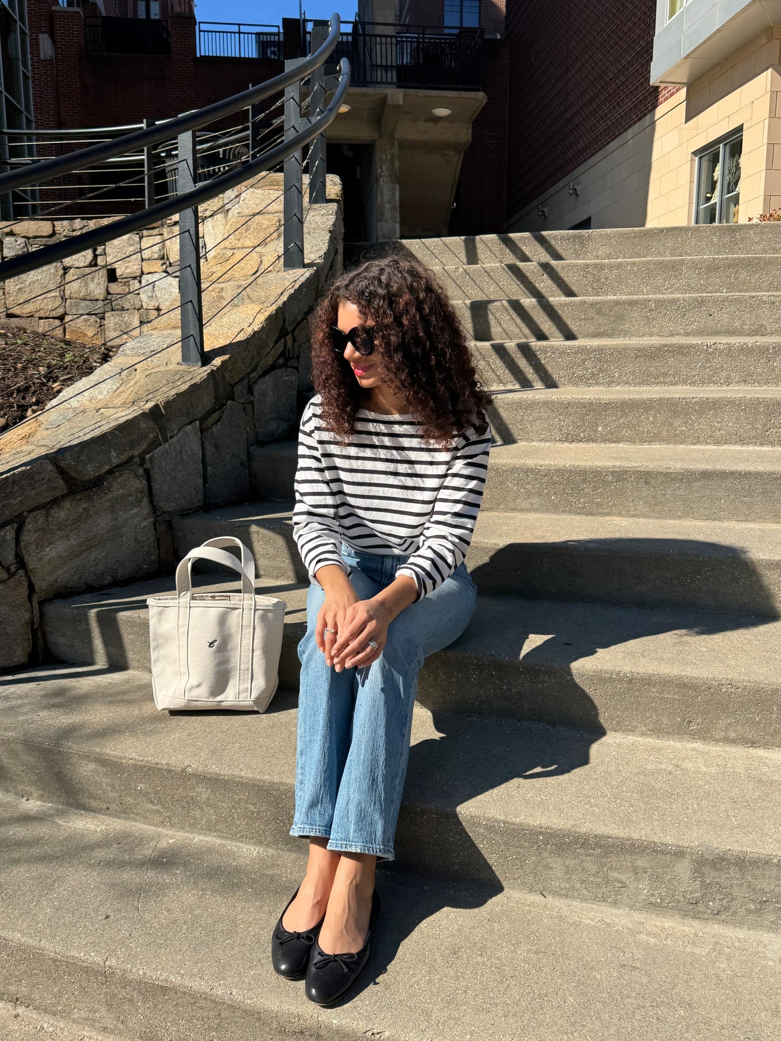 Spring outfit idea: striped shirt, light wash jeans, ballet flats, boat tote 

#LTKootd