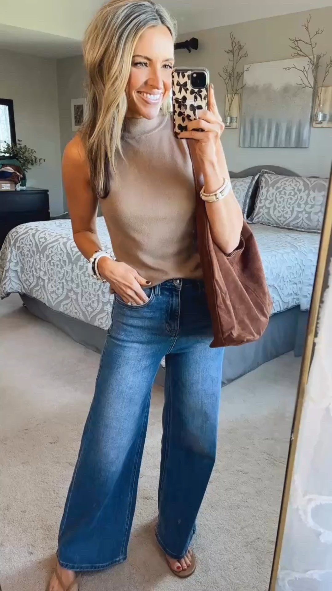 Today’s outfit of the day. This mock neck sweater tank is a great early fall top 🍂 wide leg jeans are super comfortable with stretch 🙌 this suede tote bag has been my favorite fall bag! 🤎

#LTKFindsUnder50 #LTKSeasonal #LTKStyleTip