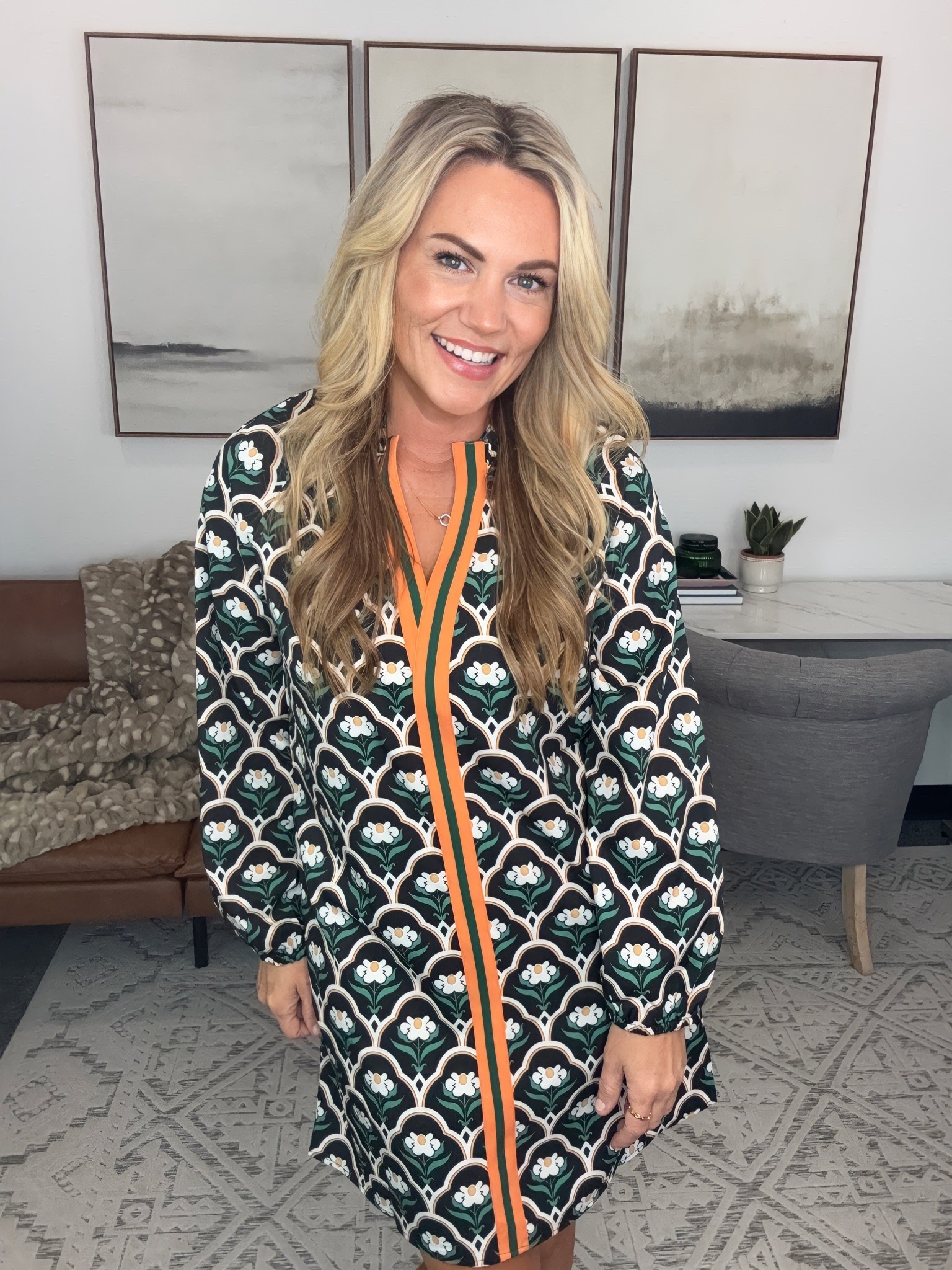 I love a dress that doesn’t need much styling to feel interesting. The bold print and contrast orange trim give this one so much personality, while the relaxed shape keeps it easy to wear from the office straight to dinner.

patterned dress, fall outfit idea, office dress, work to dinner outfit, green print dress, long sleeve mini dress, fall fashion, statement dress, transitional dress, workwear style, AudrieDollins

#LTKSeasonal #LTKOver40 #LTKootd