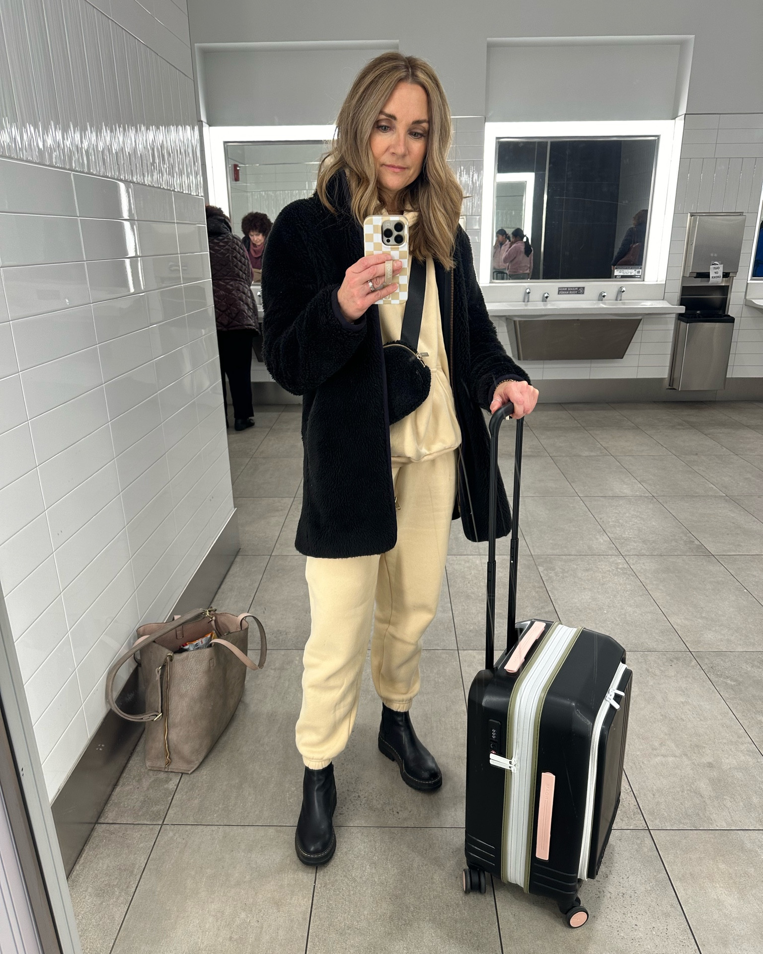 Airport outfit! Headed to colder temps so keeping cozy in a matching sweats set! Loving the compact size of my Roam carryon luggage, perfect for travel. 

#LTKtravel #LTKfindsunder50 #LTKstyletip