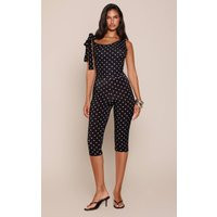 Black Slinky Polka Dot Asymmetric Capri Jumpsuit | PrettyLittleThing US