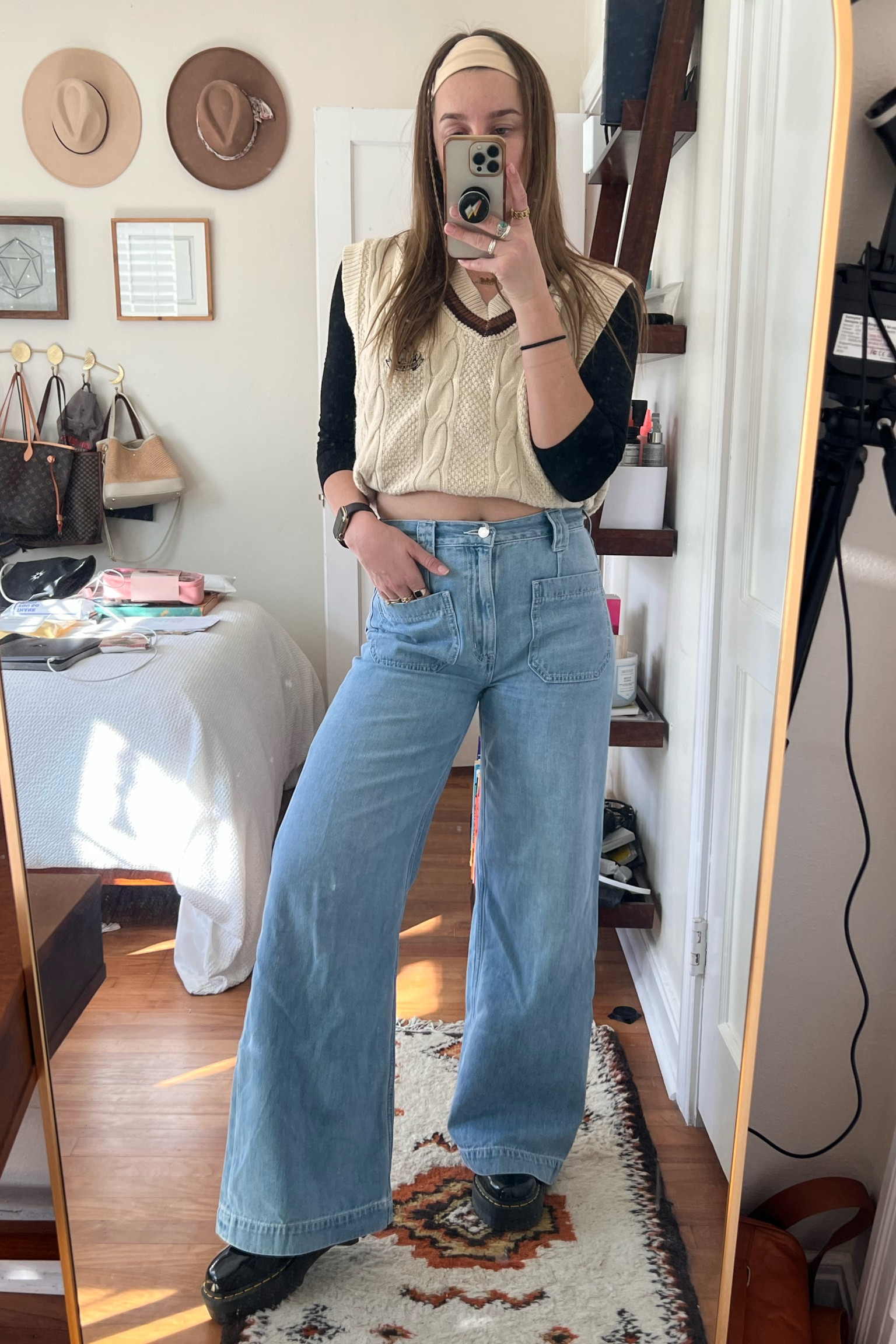 work from home fit 🤓
preppy sweater vest with a fitted black long sleeve t-shirt underneath. high waisted jeans with cute little pockets and a headband. oh can’t forget the platform dr martens ❤️‍🔥

#LTKstyletip #LTKworkwear #LTKshoecrush