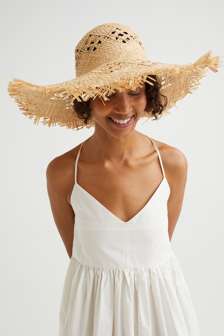 Hat in paper straw with a braided pattern. Wide, fringe-trimmed brim, and a sweatband in woven fa... | H&M (US + CA)