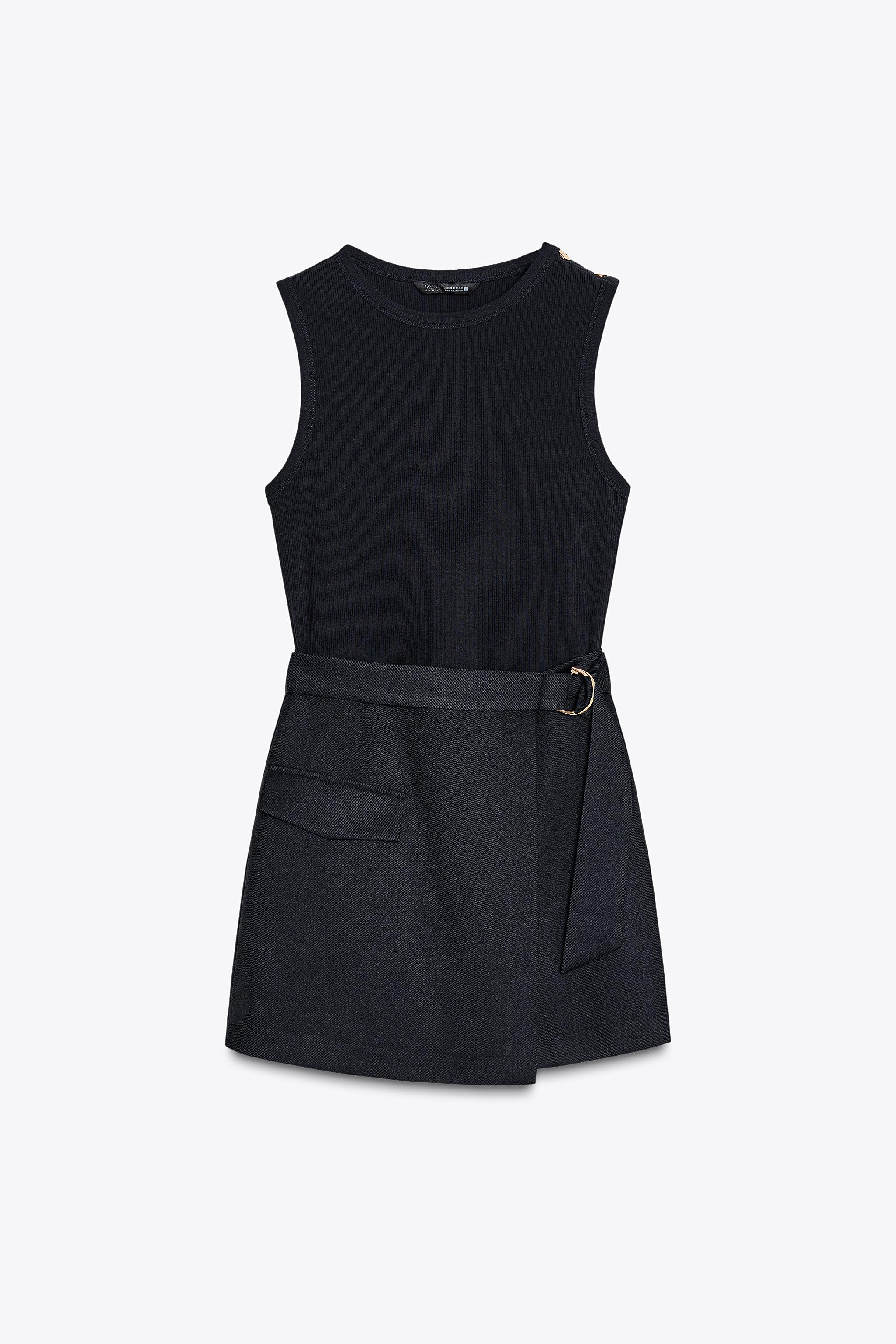 Combination jumpsuit with buckled belt. Round neck and sleeveless. Front placket detail and faux ... | Zara US