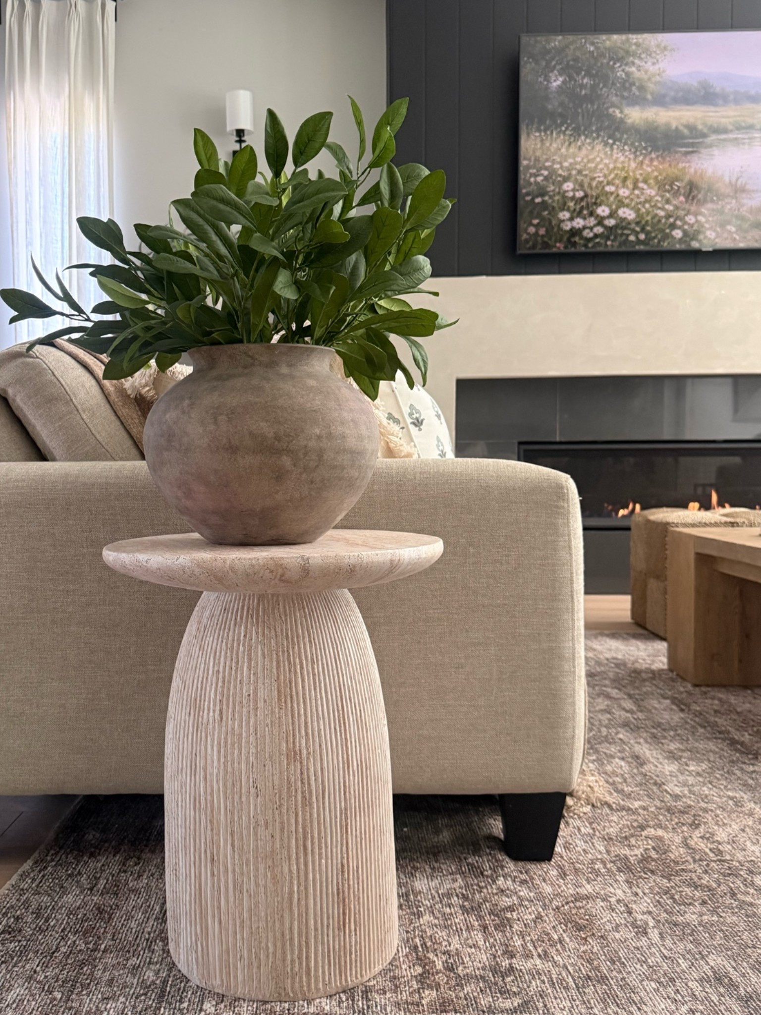 Summer in the living room. Organic accent table and rustic vase. Love these stems from Target! Giving a fresh cut look, perfect for Summer.