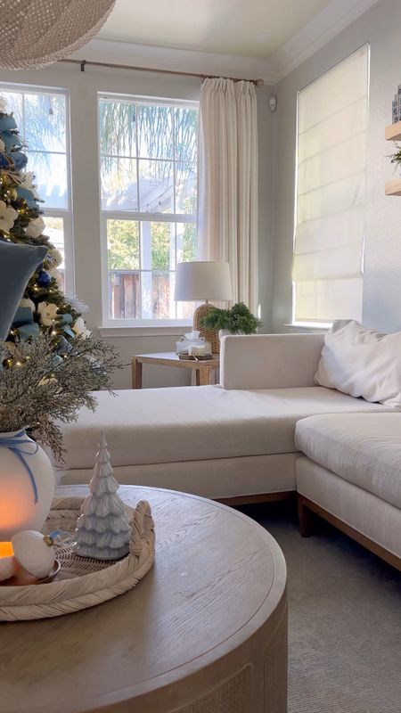 Livingroom sectional styling for Christmas. 

Coastal home, coastal decor, woven coffee table, Serena and lily, Parisian coastal Christmas, blue throw pillows 

#LTKhome #LTKHoliday