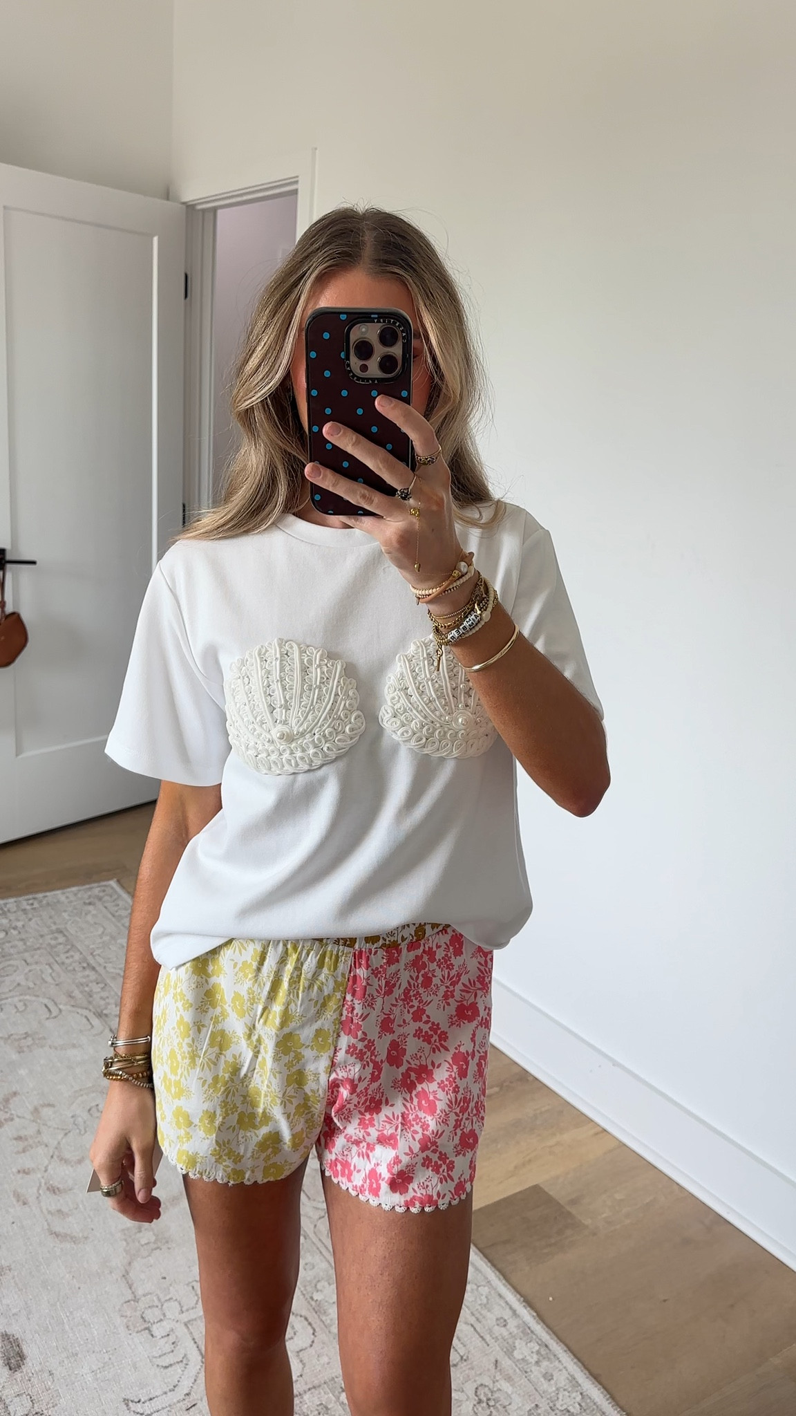 @englishfactory size xs A playful statement piece with a refined twist. This soft knit tee features intricate seashell appliques adorned with delicate pearl accents, bringing texture and dimension to a classic silhouette. The relaxed fit keeps it easy and wearable, while the elevated detailing adds a standout, coastal-inspired touch. Style it with tailored shorts or denim for a look that feels effortless yet distinct

#LTKootd #LTKSeasonal #LTKSwim