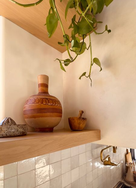Neutral southwest kitchen decor - Mexican water jug - ceramic citrus juicer - wood accents - kitchen design 

#LTKhome #LTKunder100
