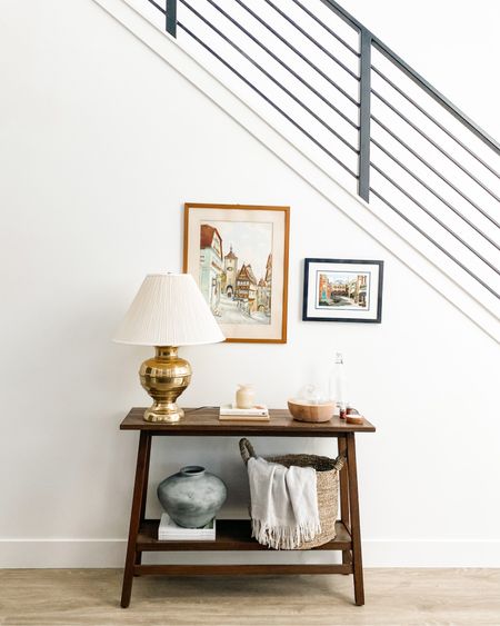 entryway design details 

entryway table, woven basket, textured vase, coffee table books, lamp 

#LTKunder100 #LTKhome