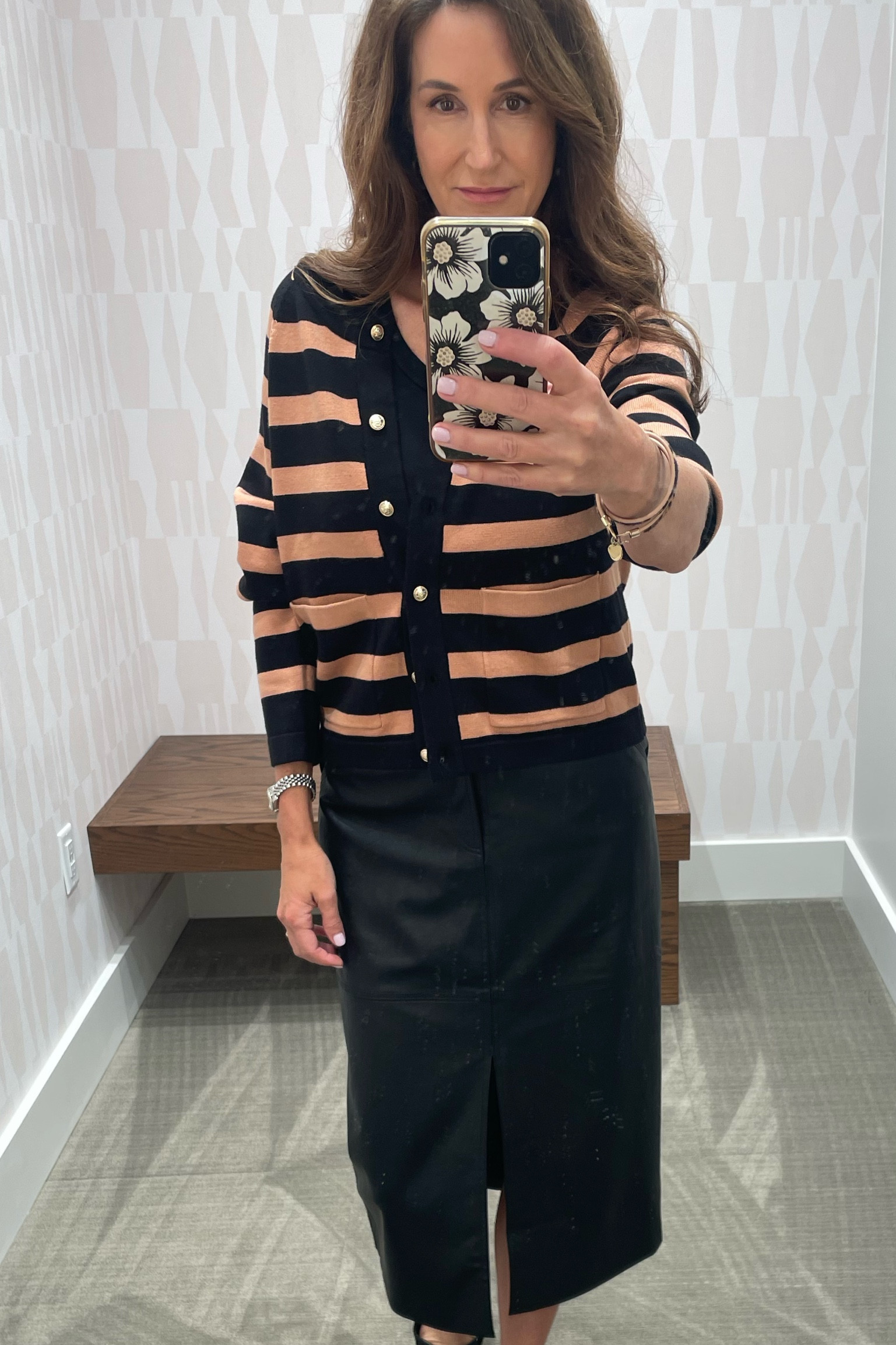 Paired the lady-like cardigan with a faux leather skirt.