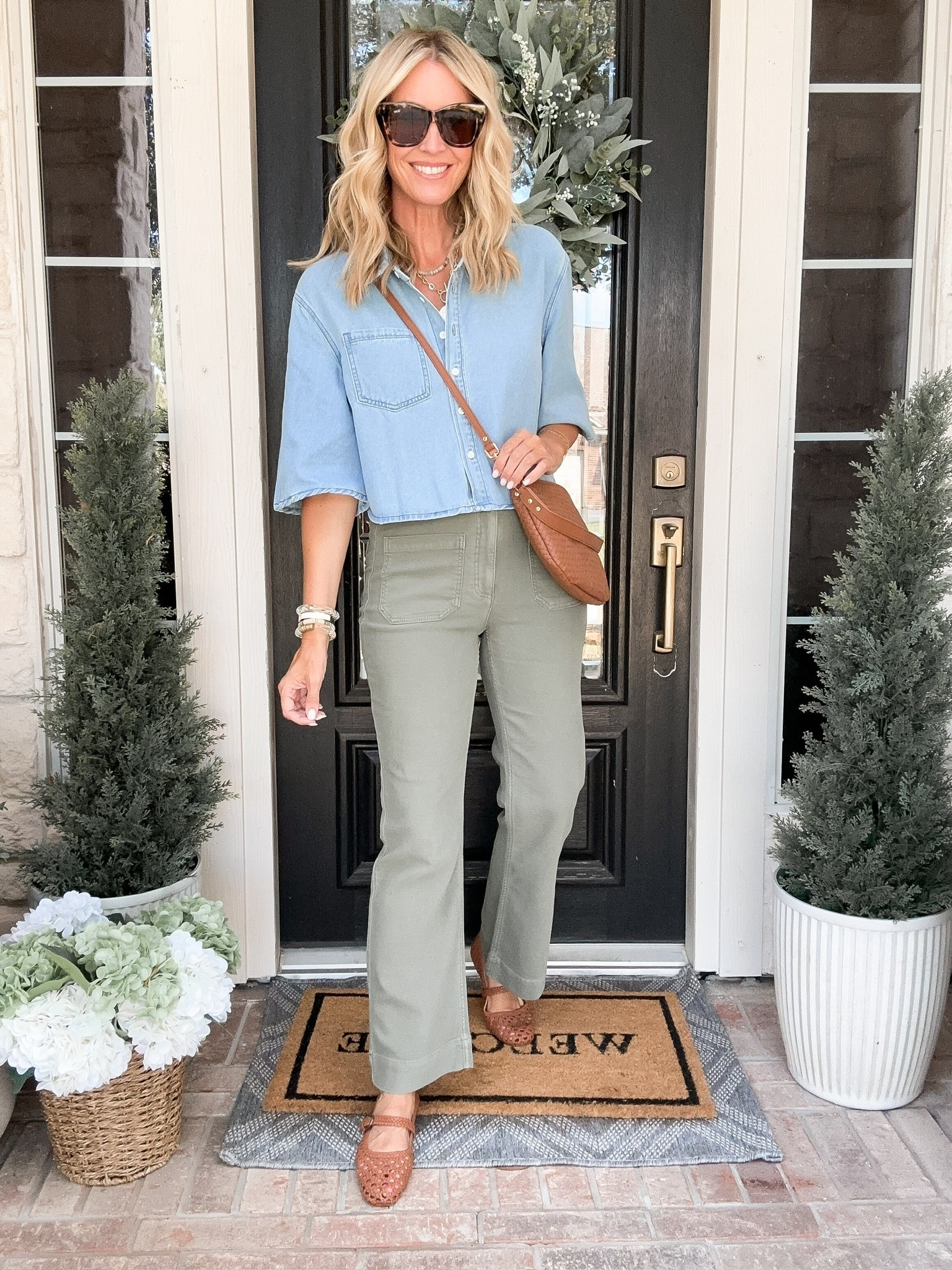 This is my kind of August outfit when I’m ready for fall colors but the weather absolutely is not. The olive pants and denim top give me that early fall feeling without adding a single heavy layer, and the woven flats are such a good finishing touch.

olive green pants, denim shirt, transitional outfit, early fall fashion, warm weather fall outfit, woven flats, casual outfit idea, fall color palette, everyday style, end of summer outfit, women’s casual fashion, hauteandhumid

#LTKgrwm #LTKTravel #LTKmomlife