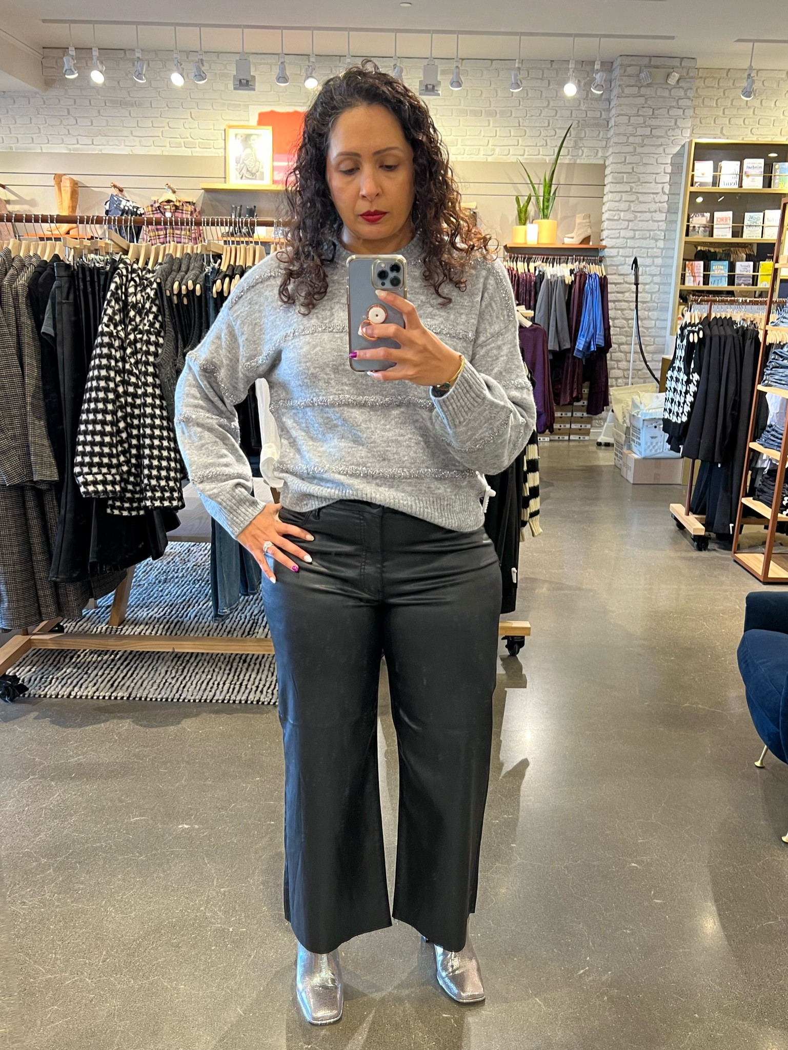 Last one in my holiday mini series!
Pictures do not do justice to this sweater. 
It’s a soft grey with tonal stripes, but the stripes are raised and they have tiny sequins embroidered. 
So the sweater delivers all the glittery oomph for the holidays without the itch of the sweaters and sequins.
I’ve kept the same black coated denim and silver boots. This sweater can also be paired with white pants and sparkly heels if you were celebrating the holidays somewhere warmer. 
The sweater is definitely a keeper! 

#LTKstyletip #LTKHoliday #LTKfindsunder100