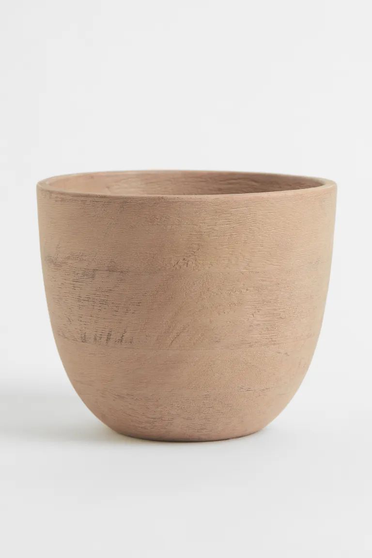 New ArrivalRustic-look plant pot in mango wood. Height 5 1/2 in. Diameter at top 6 3/4 in.Composi... | H&M (US + CA)