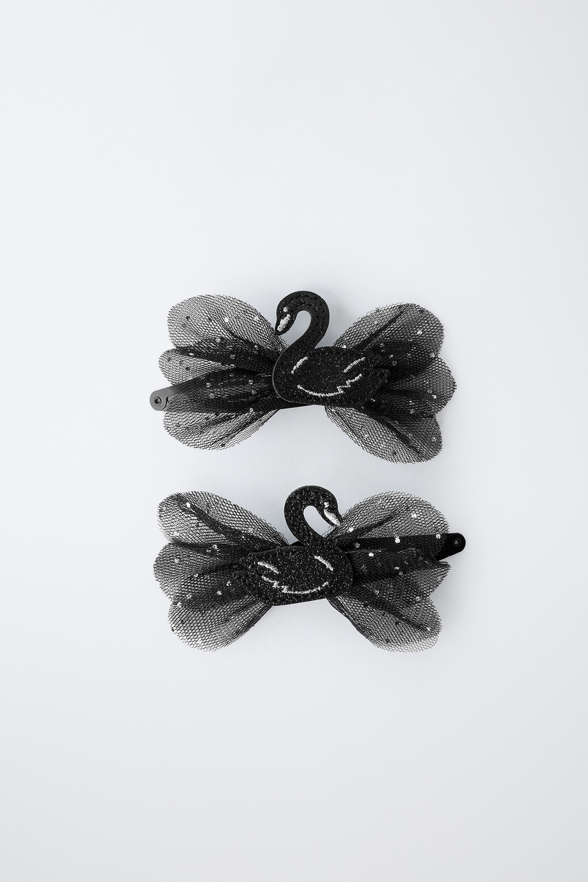 NEWPACK OF TWO SWAN CLIPS$ 9.90Black | 2326/536/800Add to cartAddTwo-piece clip set with swan and... | Zara US