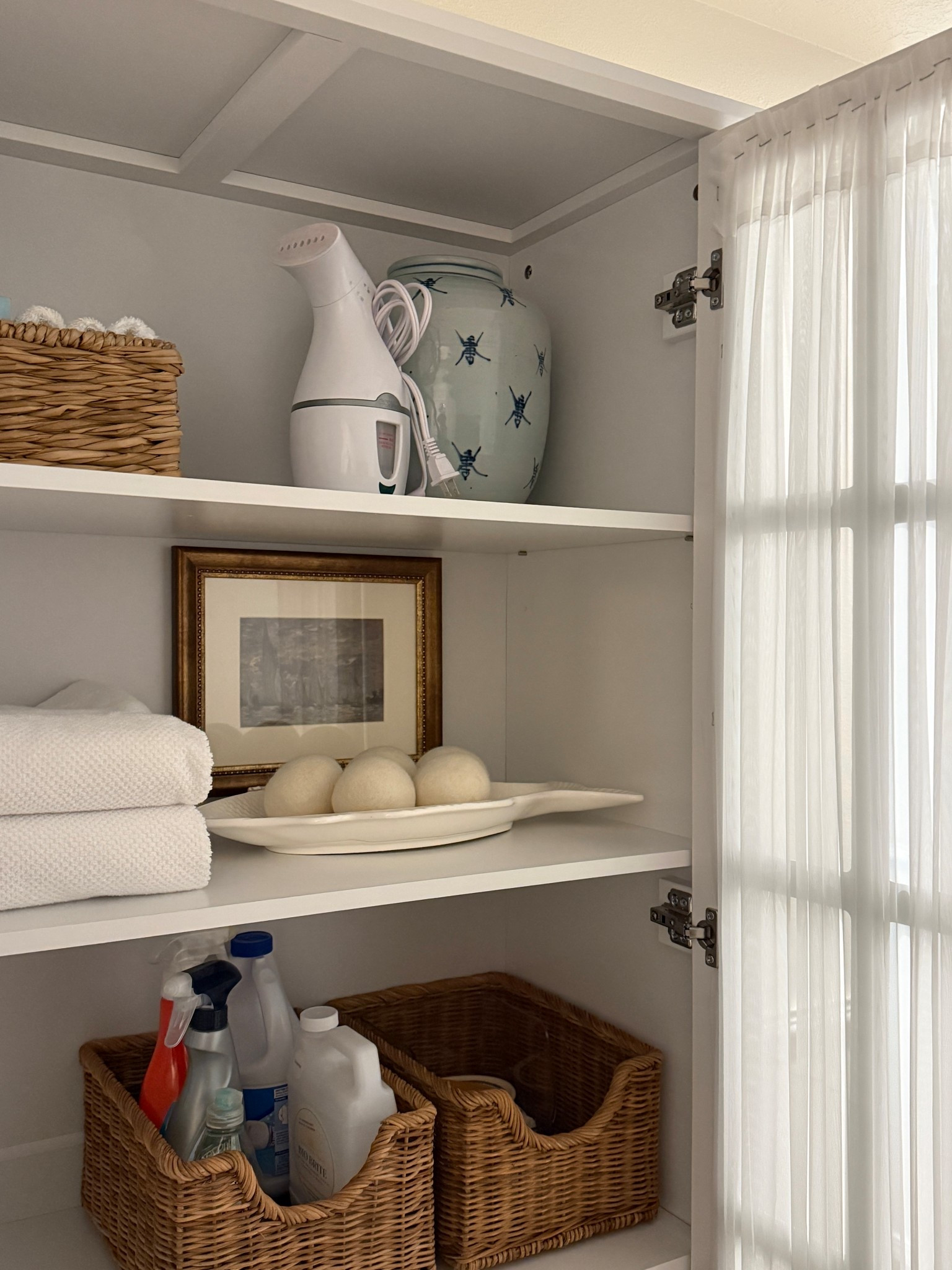 I never thought I’d see the day where doing laundry feels glamorous but here we are thanks to this new cabinet we installed this weekend! 🤩 

Added some of my signature wicker and blue + white; pretty as it is functional! 

#LTKSaleAlert #LTKFindsUnder100 #LTKHome