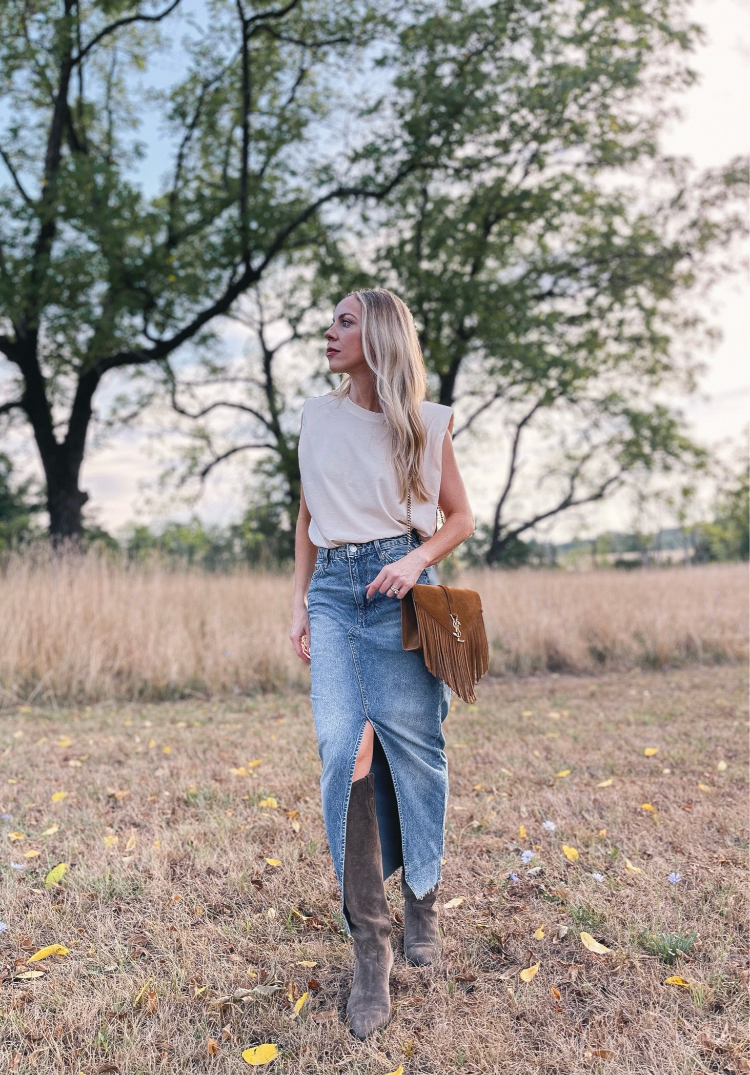Pre fall outfit with muscle tee, denim skirt, suede western boots

#LTKShoeCrush #LTKFindsUnder50 #LTKSeasonal