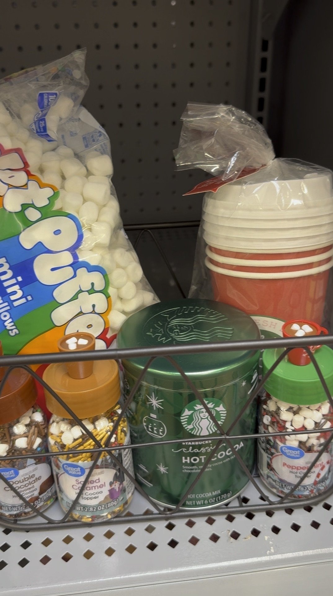 Hot Cocoa Gift Basket! Wire gift basket with Starbucks Hot Cocoa Mix, disposable cups with lids, or could use a Christmas mug, hot cocoa toppings and mini marshamallows. The perfect gift! Gifts for kids, gifts for couple, gift guide, gift idea #Giftbasket #hotcocoabasket #starbucksgift #giftforher #giftforhomebody

#LTKHoliday #LTKGiftGuide #LTKSeasonal