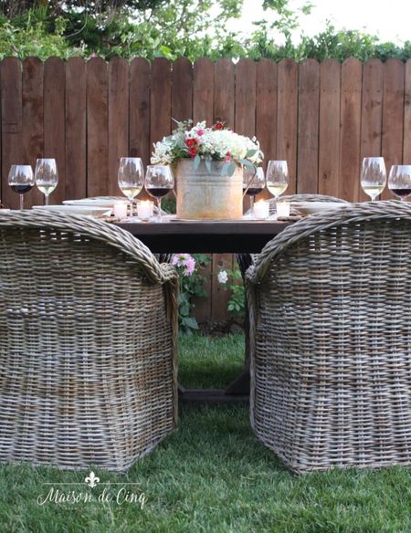 Outdoor table with pretty wicker chairs creates the perfect outdoor dining space!

#homedecor #outdoordecor #summerdecor #patiofurniture #outdoordining 

#LTKSeasonal #LTKFind #LTKhome