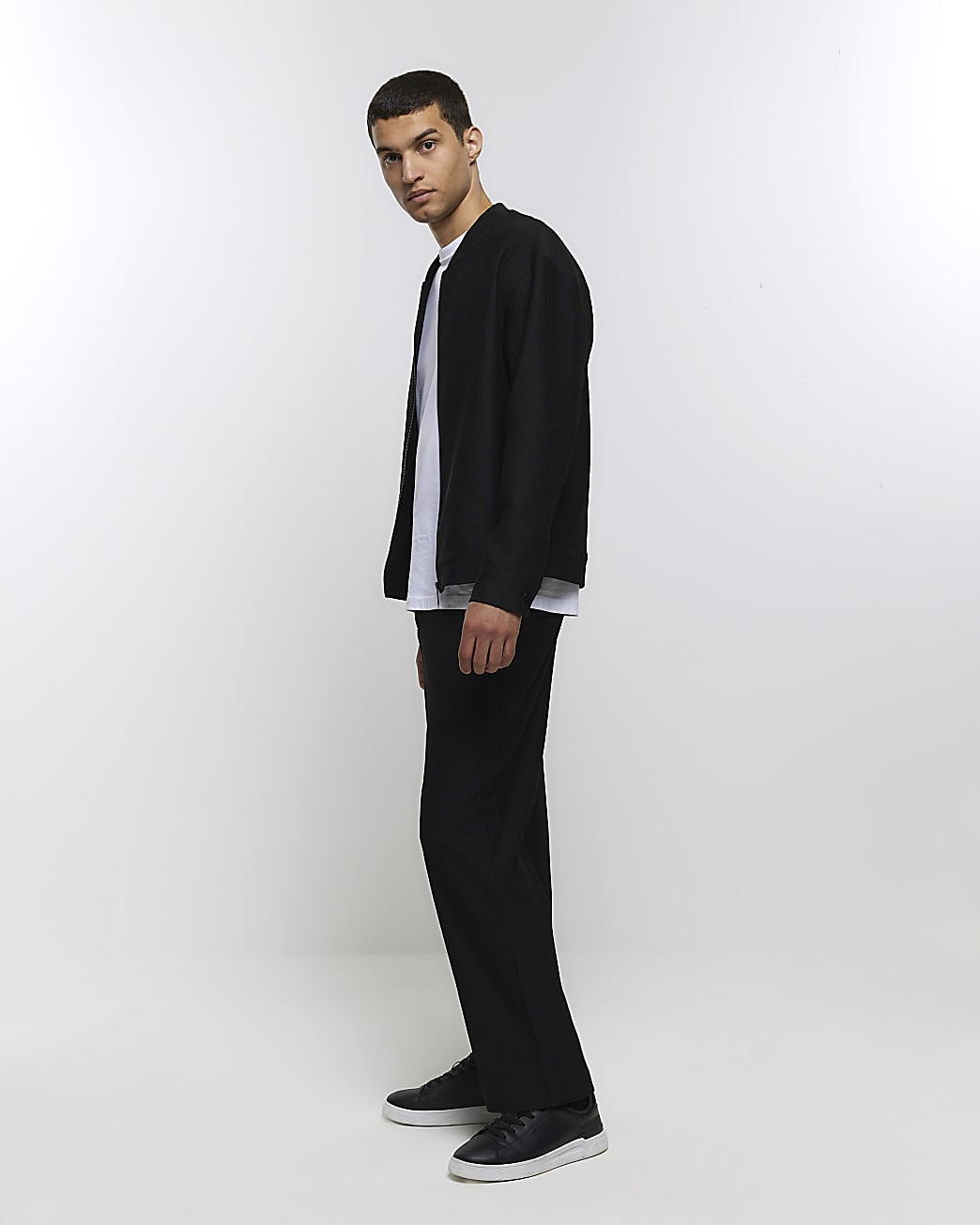 Black tapered fit plisse smart trousers | River Island (UK & IE)
