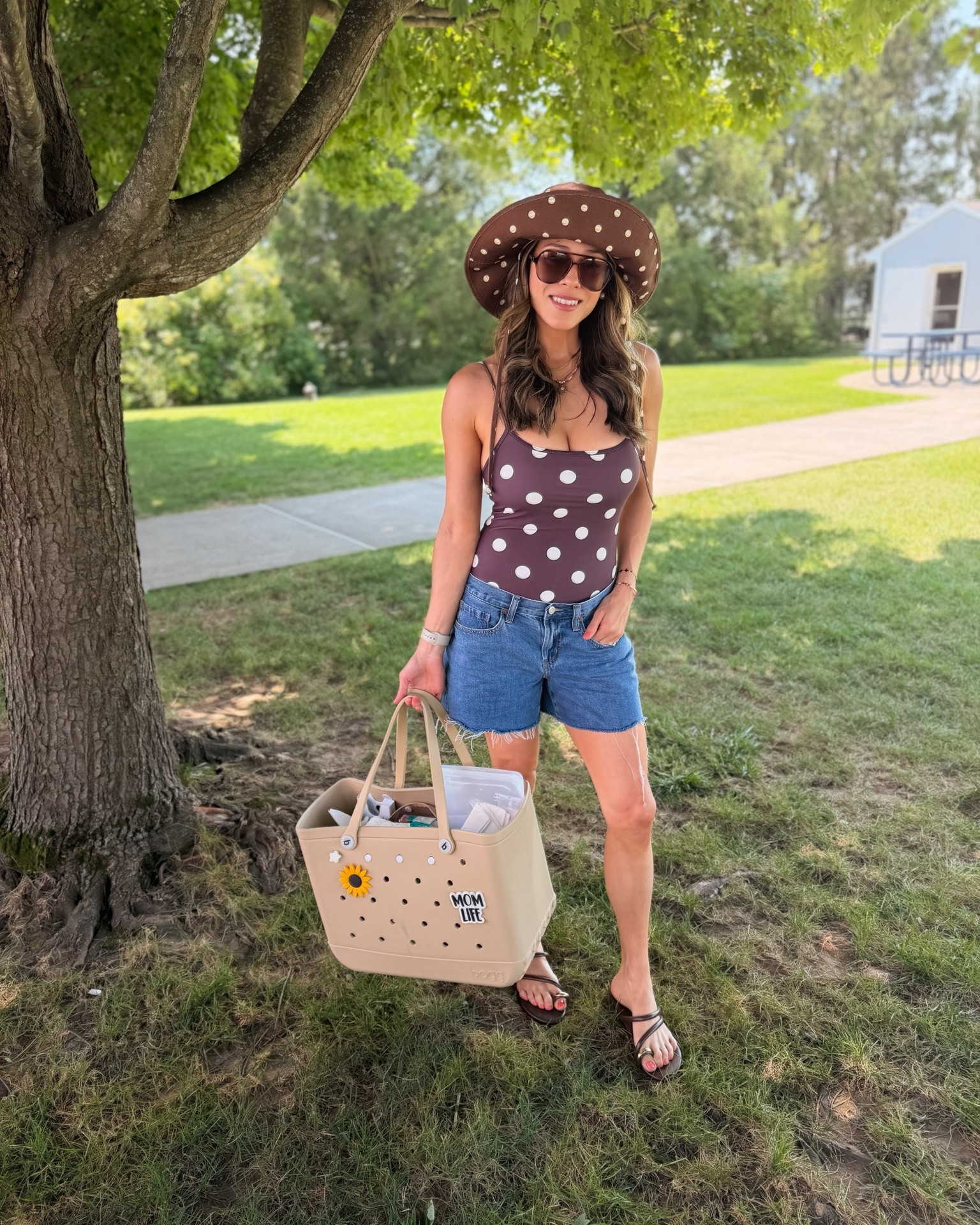 Polka dot obsessed! And this bag fits everything. Perfect family swim day fit ☀️🤎 One piece runs big. Wearing size small. 27 in shorts for a looser fit. Hat is a s/m!

#LTKootd #LTKmomlife