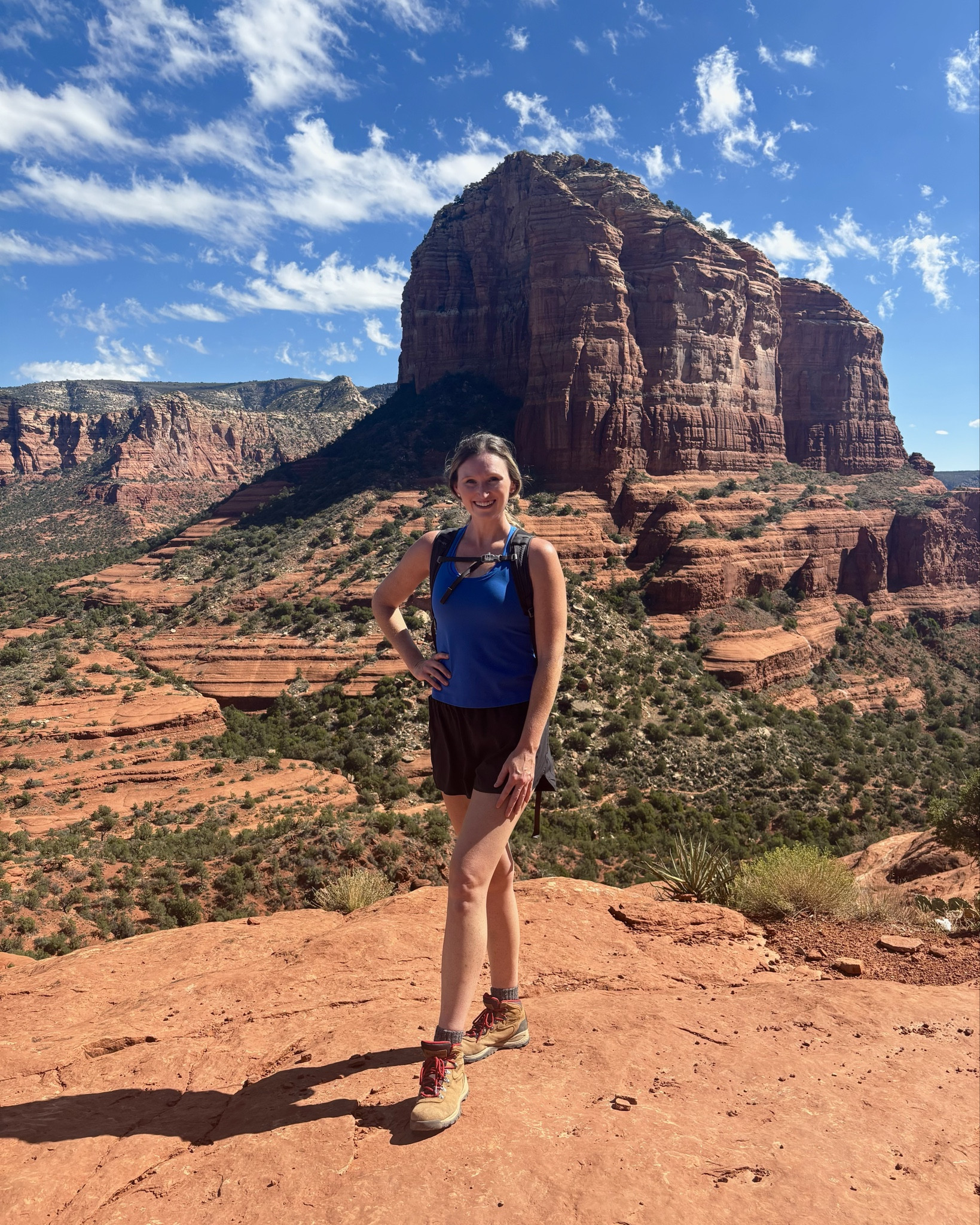 Affordable fall transition hiking outfit. Sedona hiking outfit. Blue workout tank (sized up to L) with matching blue strappy sports bra, black active shorts with  built in shorts under, comfortable hiking boots 

#LTKTall #LTKTravel #LTKActive