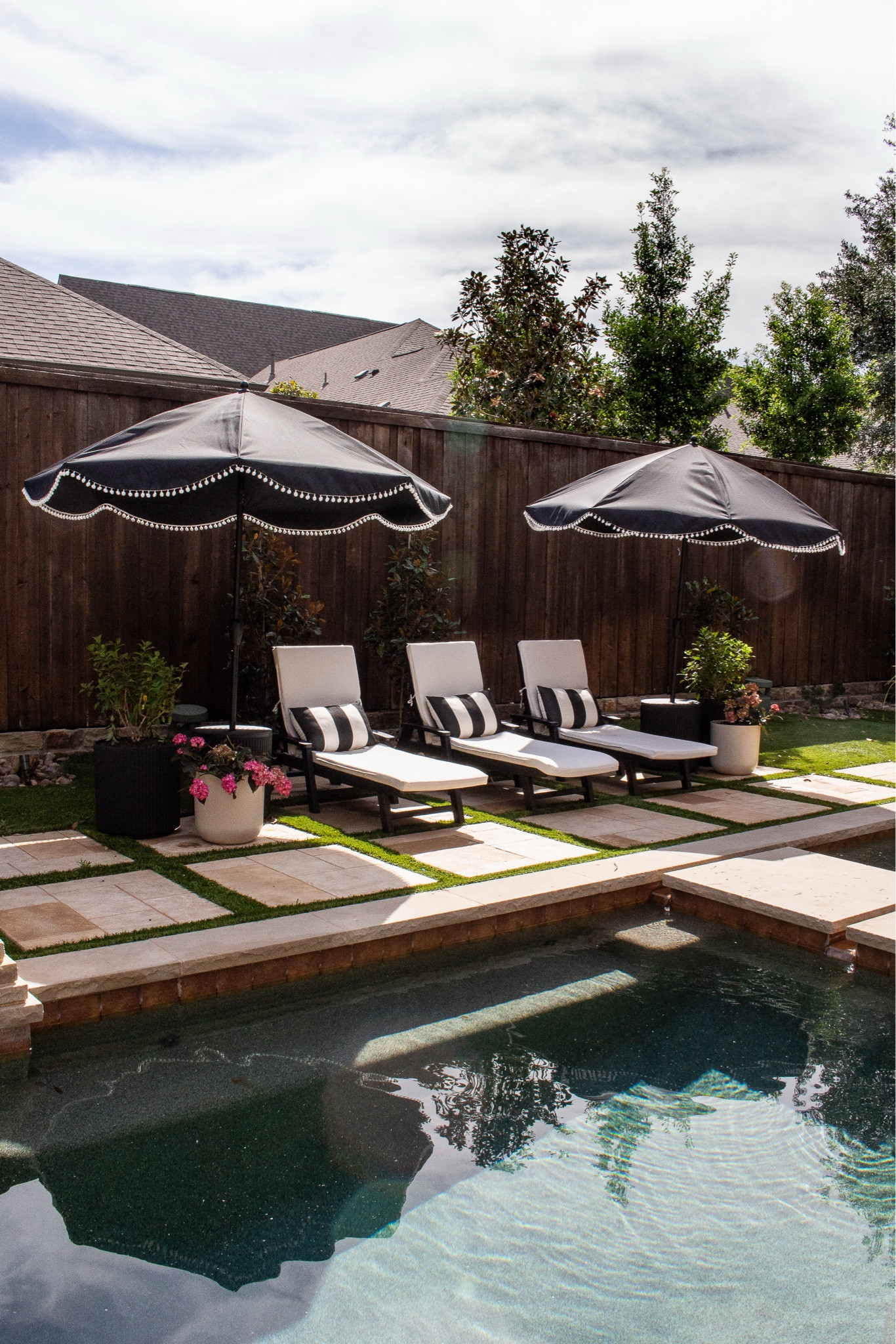 Backyard pool design with modern outdoor furniture. Poolside lounge chairs, outdoor patio umbrellas, backyard pool ideas, neutral outdoor decor, summer backyard inspiration, outdoor living space, pool patio furniture.

#LTKHome #LTKdayinmylife #LTKSeasonal
