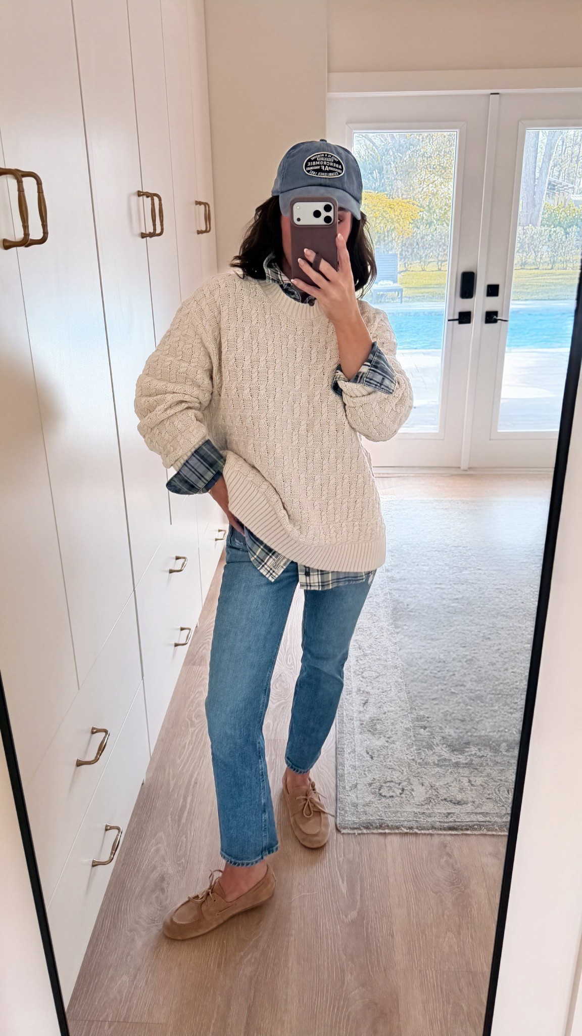 Wearing a small in both tops
Jeans in a 25 petite 
Shoes true to size 

Cozy cable knit sweater layered over a classic plaid button-down, styled with straight leg denim, loafers, and a casual baseball cap for that effortless, lived-in look. This Abercrombie sweater is oversized, soft, and ideal for transitional weather—perfect for school drop-off, weekend errands, or casual fall days. I love a neutral fall outfit that mixes texture and timeless staples for an easy, put-together vibe. Classic, comfortable, and endlessly wearable 🤍

#AbercrombieStyle #AbercrombieFinds #FallOutfitIdeas #EverydayFallStyle #CasualFallLook #LayeredFallOutfit #CableKnitSweater #PlaidLayering #StraightLegJeans #NeutralFallStyle #ClassicCasual #EffortlessStyle #MomStyle #WeekendOutfit #FallCapsuleWardrobe #TimelessStyle #CozyFashion

#LTKootd #LTKmomlife #LTKPetite