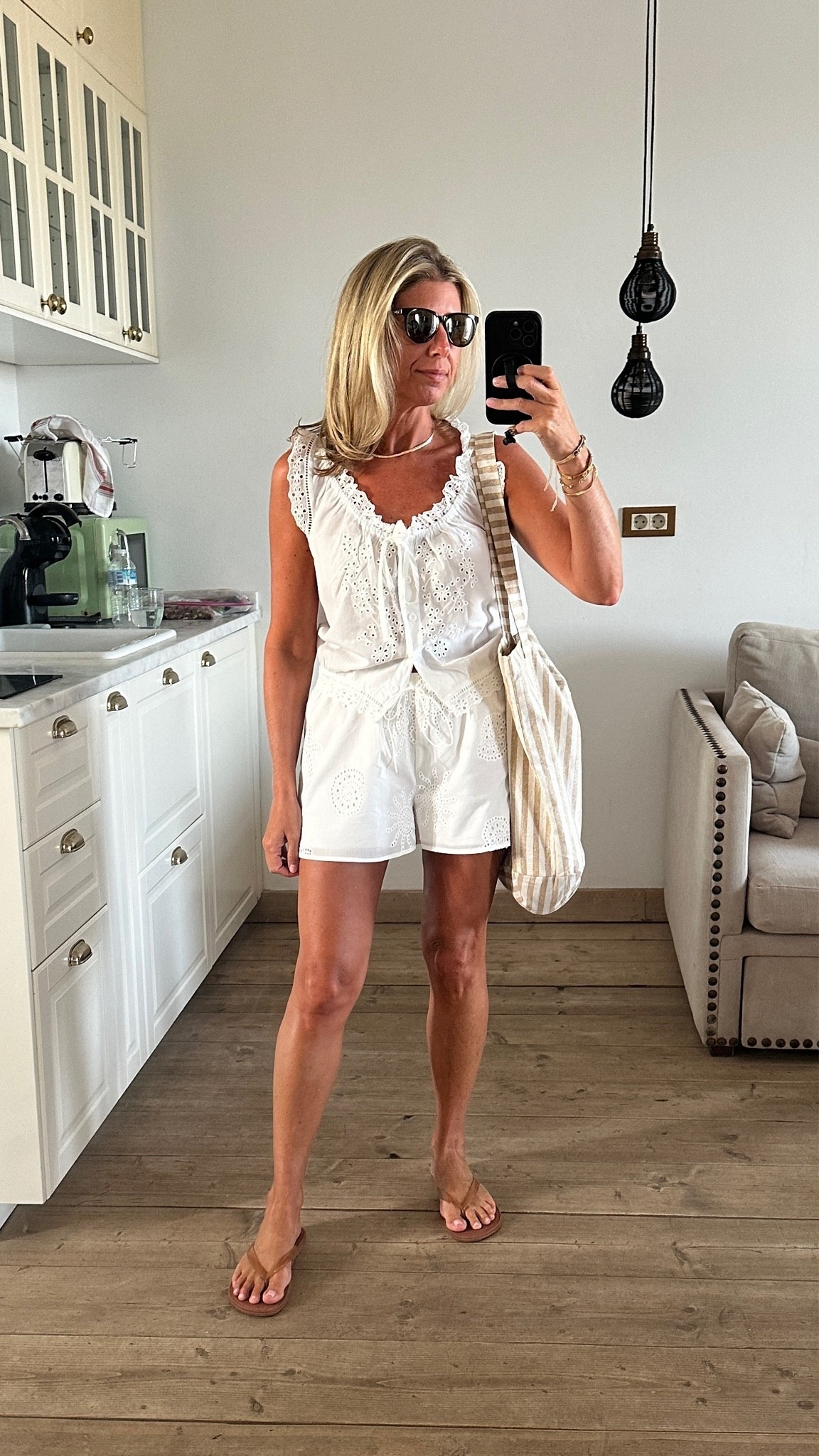 Love this white top for super hot days - lightweight but not see thru. (Looks like $$$ Doen one but only $12!) I wore these flip flops around town and the pool. Love the nude straps. go with your larger size…I’m normally an 8.5 but got the 9. (Whole sizes only) 
Linked similar shorts. 

Summer vacation Greece Spain Italy Mallorca white eyelet set

#LTKTravel #LTKSeasonal #LTKOver40