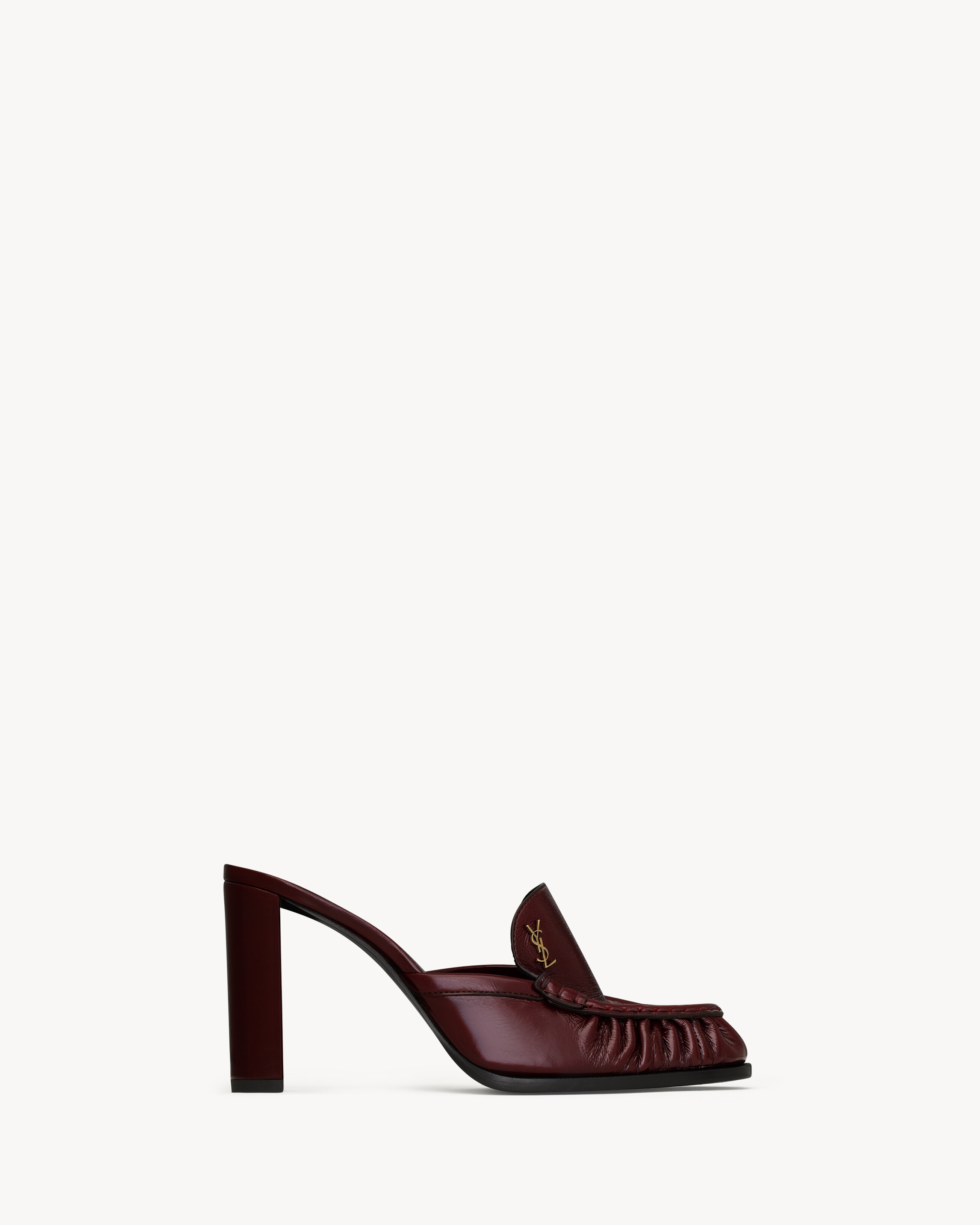 supple penny loafer mule pumps decorated with the CASSANDRE, featuring a hand-stitched moc toe an... | Saint Laurent Inc. (Global)