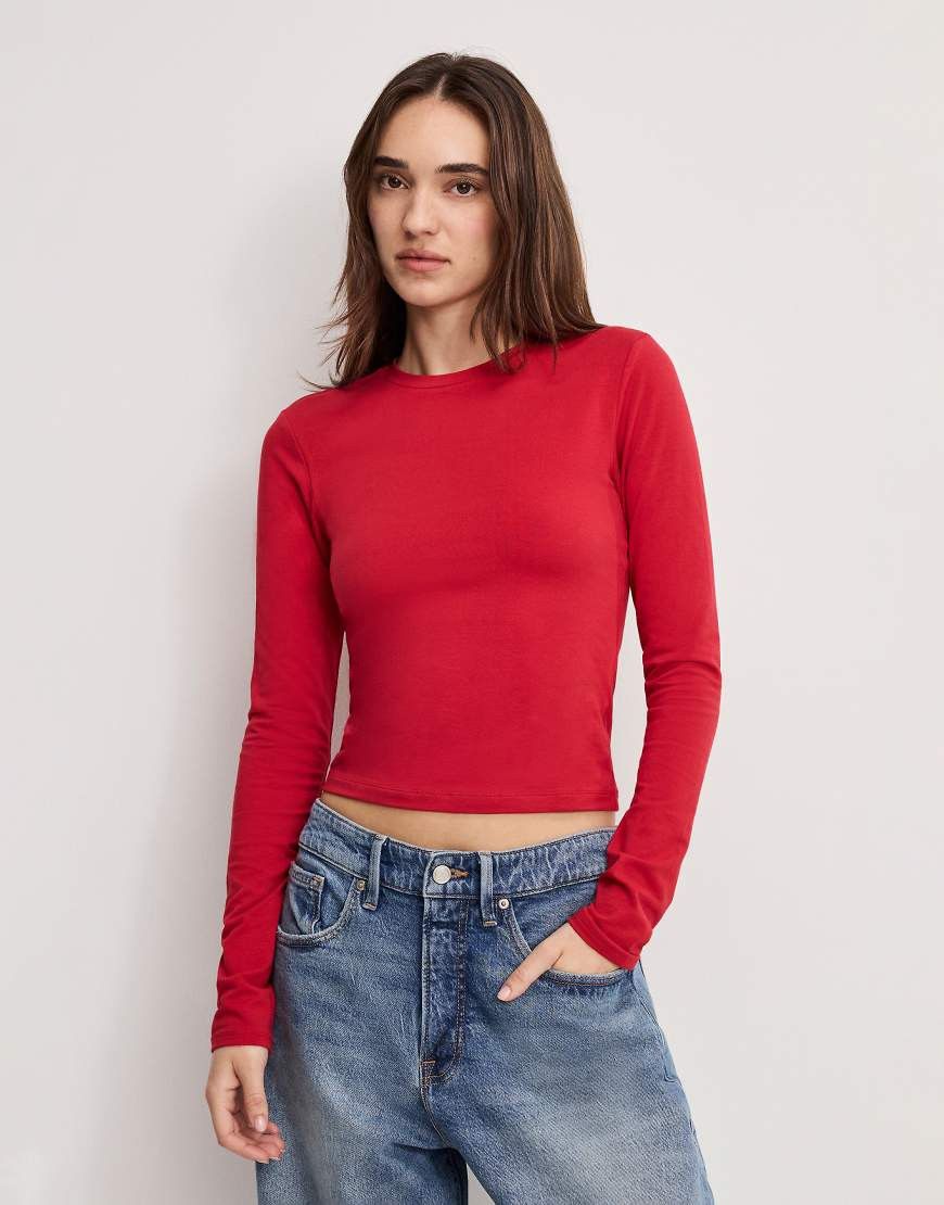 Good American cotton rich crew neck long sleeve top in red | ASOS (Global)