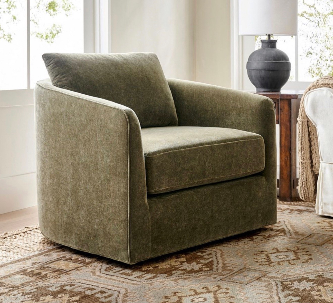 I walked into Pottery Barn the other day and fell in love with this chair! This one is Rustic Chenille, Dark Moss but there are a lot of different fabric colors and styles to choose from. Also love this as a reading chair, nursery chair, or bedroom accent. The swivel makes it extra functional, and the mossy green tone adds that cozy, moody warmth that works so well with many styles.

swivel accent chair, pottery barn chair, cozy living room furniture, organic modern decor, neutral home, moody green furniture, reading chair, bedroom accent chair, nursery chair, high end home decor, warm neutral living room, Living room furniture, bedroom furniture, accent chair, moody furniture ideas, comfy chairs, pottery barn, home decor ideas

#LTKHome