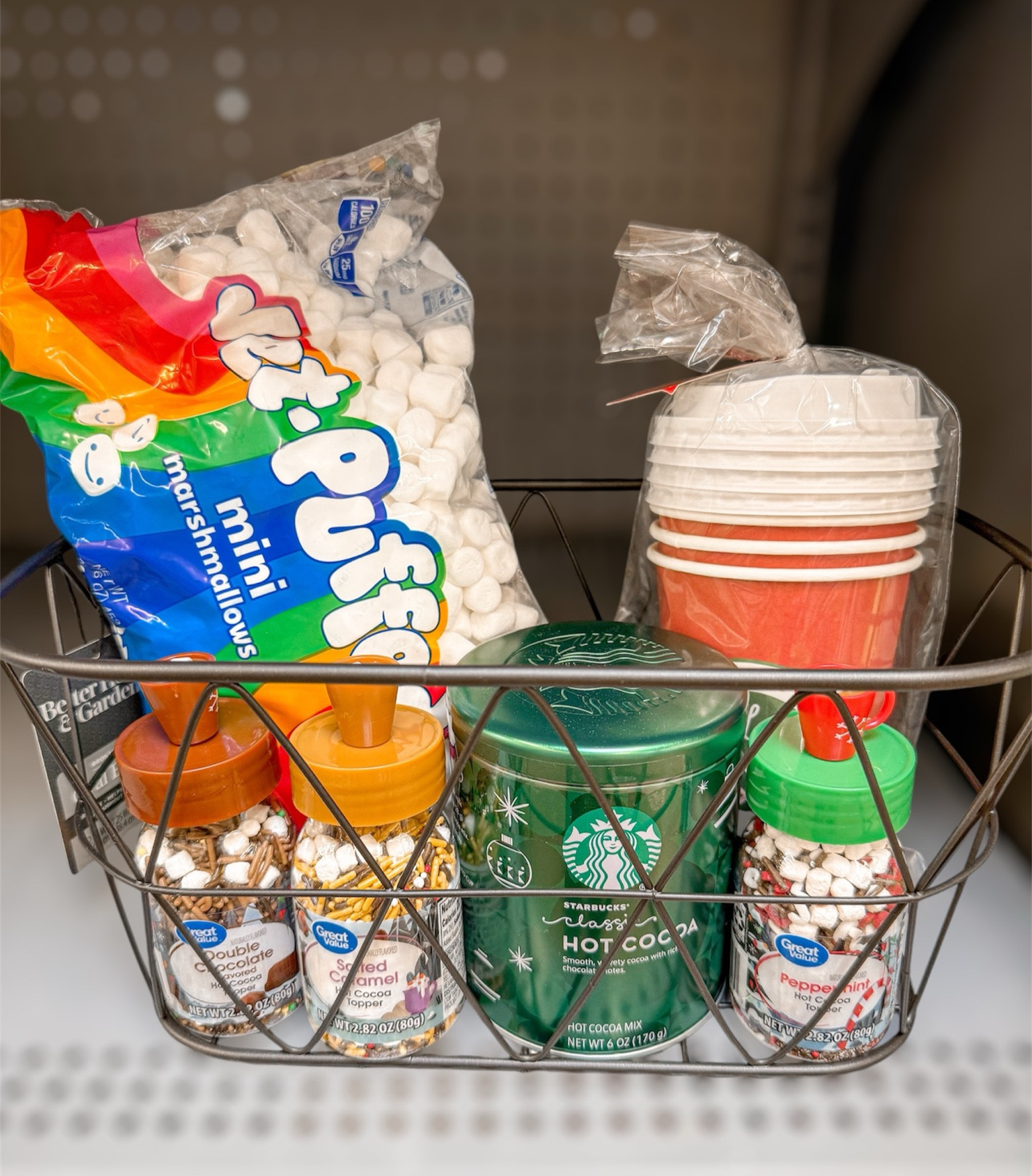 Hot Cocoa gift basket idea! Wire basket, Starbucks Hot cocoa mix, hot chocolate toppings, mini marshmallows and to go cups or Christmas mugs! Easy, affordable gift for friends, teachers, neighbors, etc. And all under $30

#LTKSeasonal #LTKHoliday #LTKGiftGuide