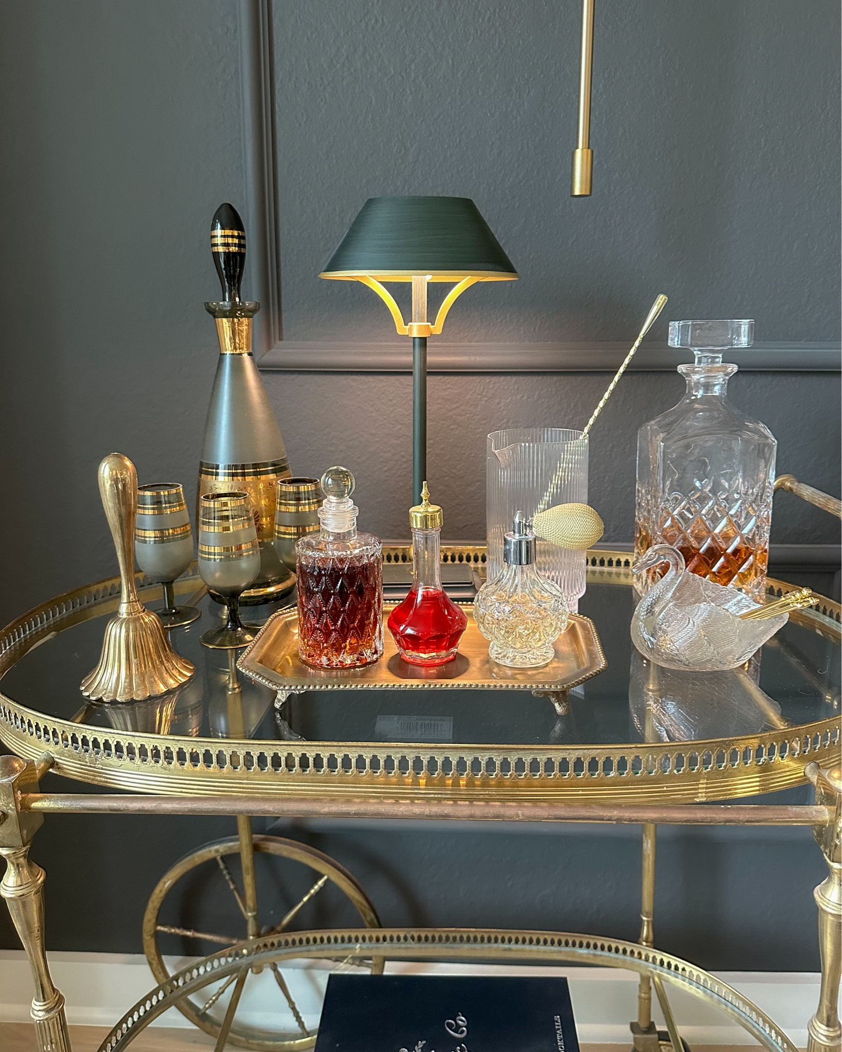 Bar cart styling including this wireless lamp and all the fancy little things for cocktail hour ☺️🍸 

My tall decanter set, swan, tray, bar cart and bell are vintage!

#LTKstyletip #LTKfindsunder50 #LTKhome