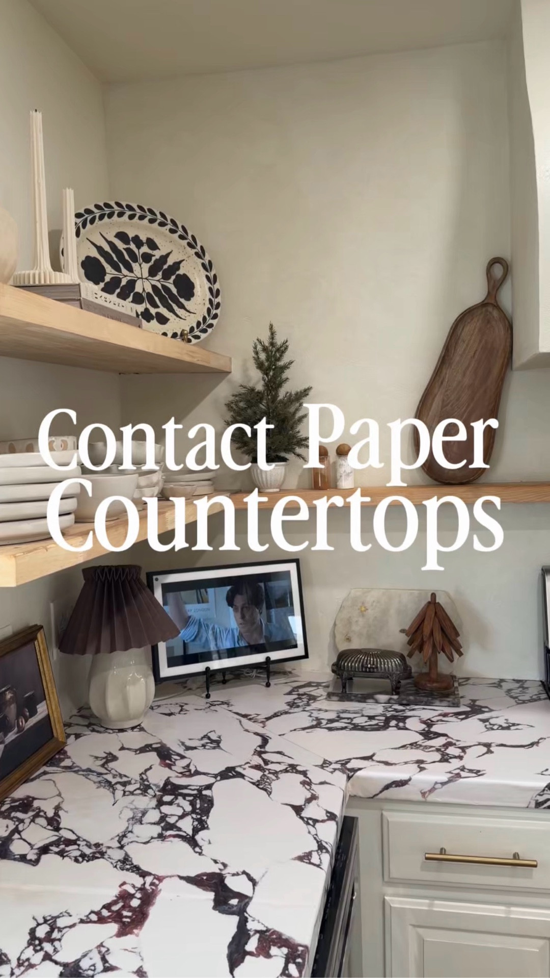 Save this if you’re looking for a budget-friendly kitchen countertop makeover. These Calacatta Viola marble contact paper countertops gave me the dramatic, old-world stone look I wanted without the cost or commitment of real marble.

This is one of my favorite renter-friendly kitchen DIYs because it’s completely removable. If I ever change my mind, I can peel it off or switch it out for a different marble look contact paper down the road — no demo, no mess, no regrets.

I get asked all the time how this contact paper countertop has held up. I’ve had it on my coffee bar countertop for about a year and a half, and in the rest of my kitchen for around six months. It’s held up extremely well. There are a few light scratches and small dings from everyday life, but nothing major.

I didn’t even caulk around the sink, and the adhesive is strong enough that nothing is peeling — even with constant water splashes. If you’re on a budget, in a rental, or just not ready to commit to real stone, this is such a solid DIY kitchen upgrade.

#ltkhome #ltkkitchen #kitchendiy #budgetkitchen 

#LTKFindsUnder100 #LTKstorytime #LTKHome