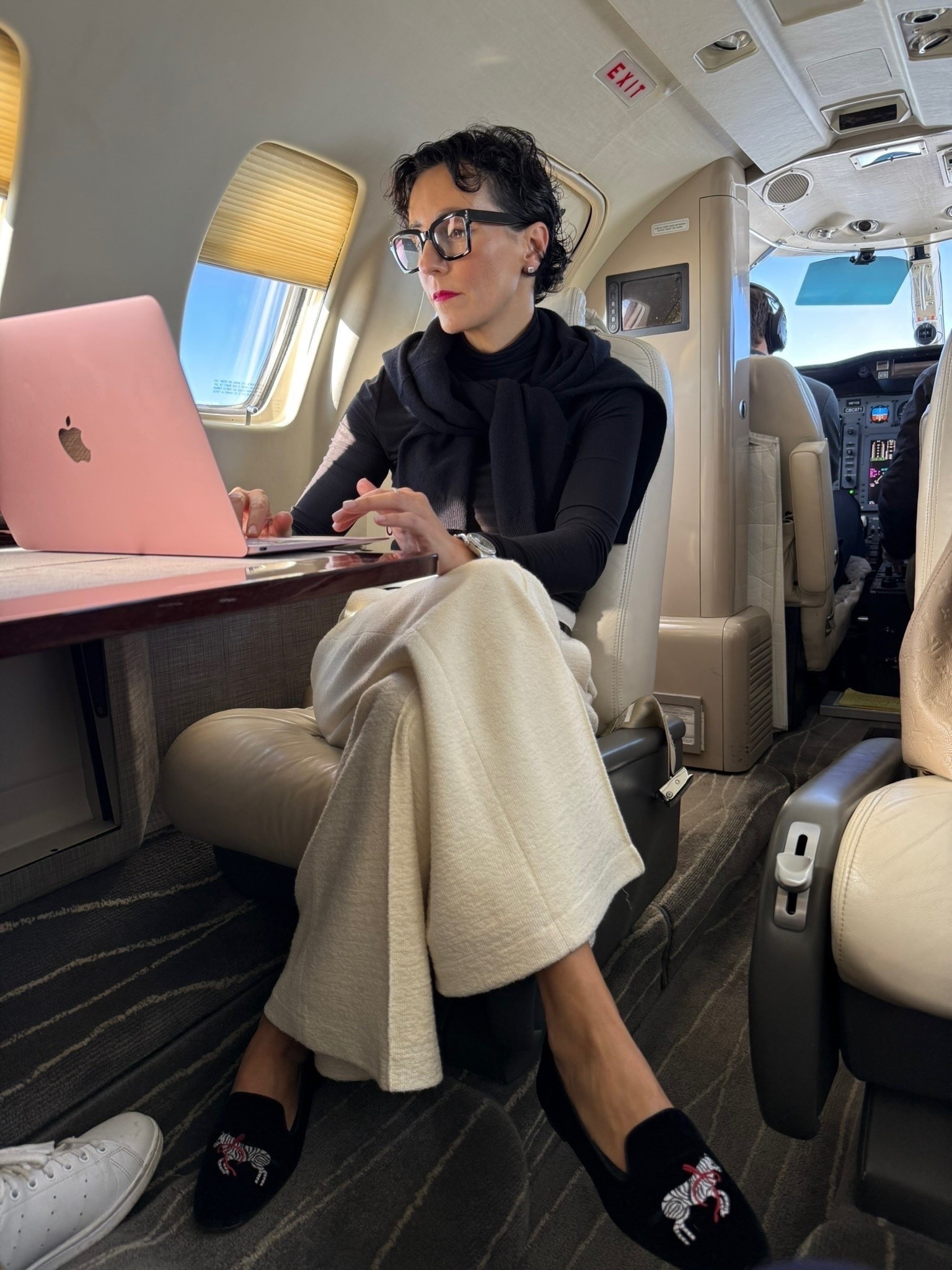 Travel days call for comfort, but I still want to look polished when I arrive! I love pairing a fitted black turtleneck with relaxed cream trousers for a classic, comfortable outfit. The sweater draped over my shoulders gives me an extra layer for the plane, and the embroidered loafers add a little personality. These are the kinds of pieces I love packing because they can be styled again throughout the trip.

travel outfit, airport outfit, comfortable travel style, cream trousers, black turtleneck, embroidered loafers, travel wardrobe, women over 50 style, elevated travel outfit, classic travel style, fall travel essentials, stylewitheugenia