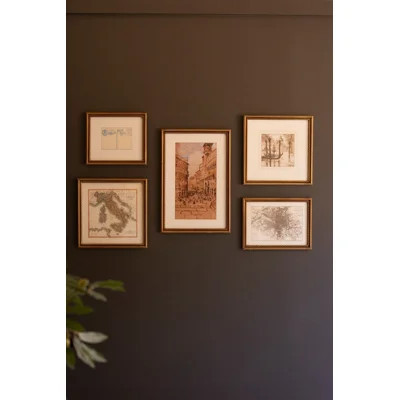 five vintage European prints in gold frames on a wall