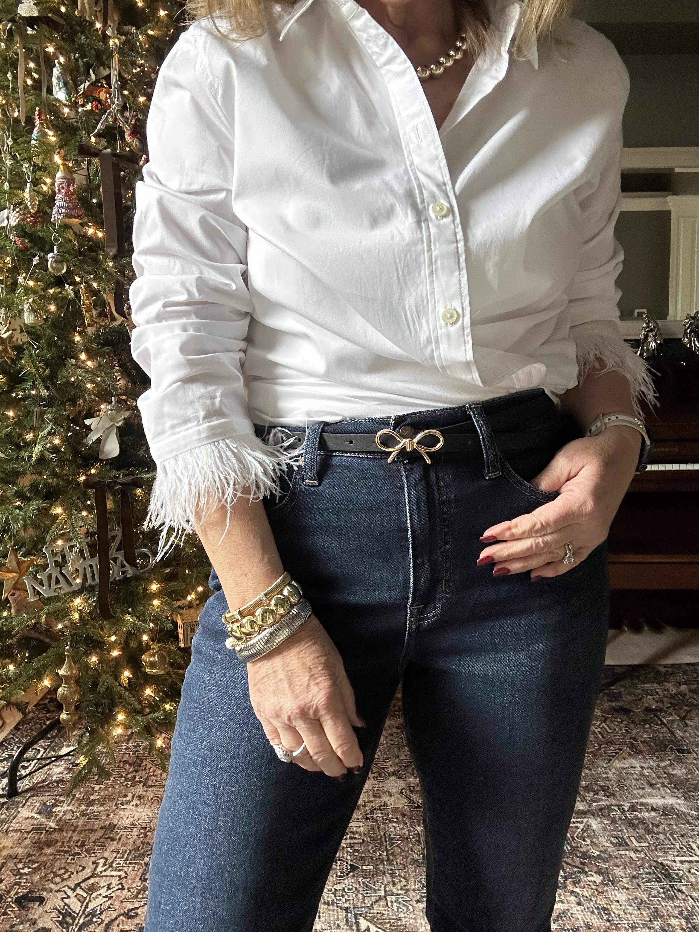 This white blouse with feather trim has been popular! I sized up to a large, so I’m able to do the crisscross tuck.

Bow belt I’m wearing a size medium 
Jeans, I am wearing my smaller size 

Gold jewelry by Allie+Bess 20% off code NANETTE20

White blouse, feather trim, straight leg jeans, J.Crew factory jeans, Dolce Vita boots

#LTKFindsUnder100 #LTKOver40 #LTKHoliday