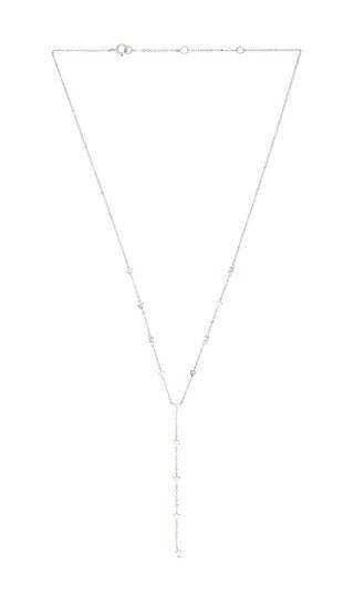 SHASHI Solitaire Station Lariat Necklace in Metallic Silver. | Revolve Clothing (Global)