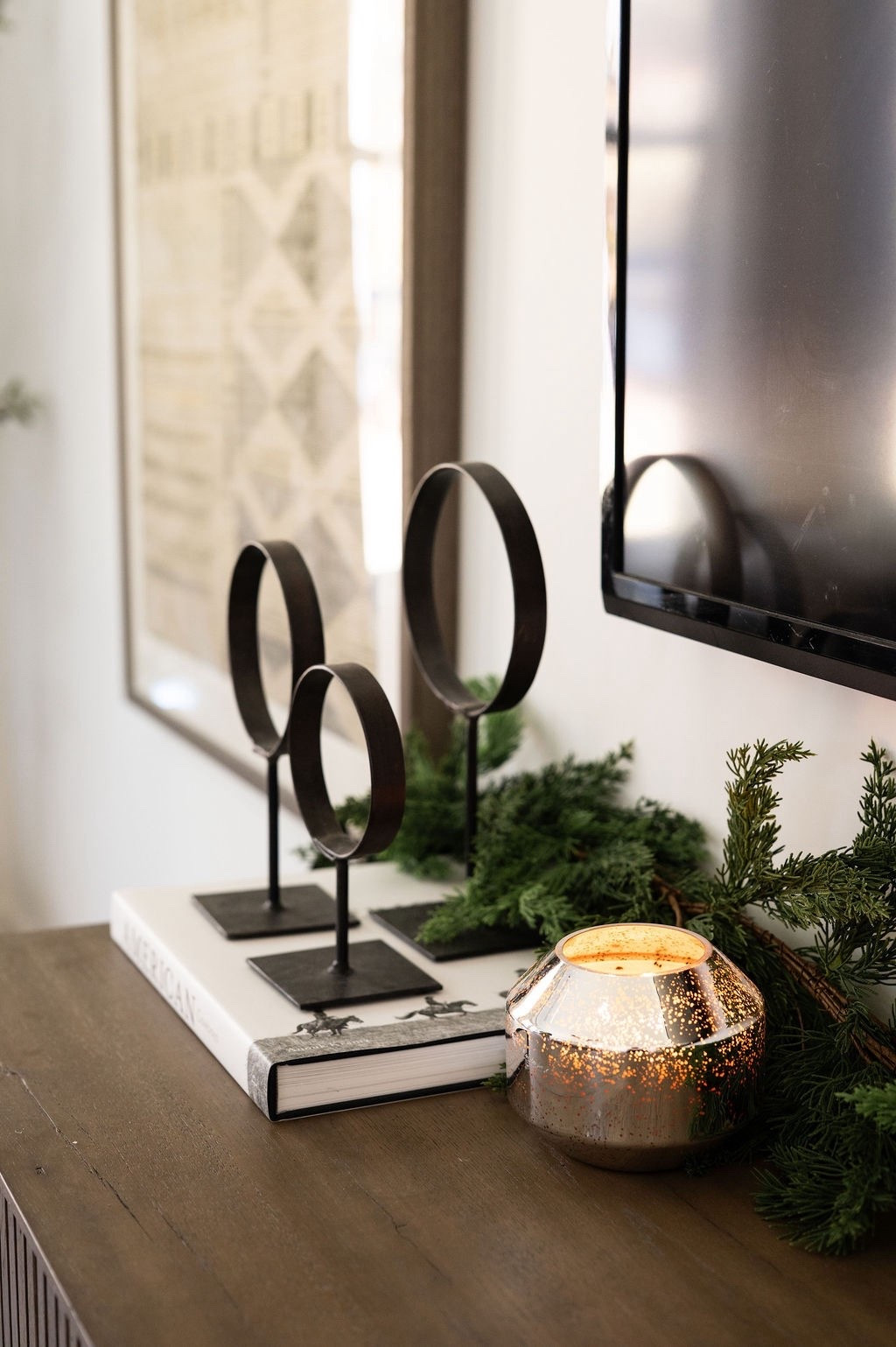 Loving the contrast of simple black décor pieces from Amazon, faux Amazon Christmas greenery, and the soft shimmer of a mercury candle 🤍🌲 A beautiful touch for modern holiday styling in your bedroom, organic Christmas décor, winter shelf styling, neutral festive home ideas, and LTK holiday decorating inspo.

#LTKHome #LTKHoliday #LTKSeasonal