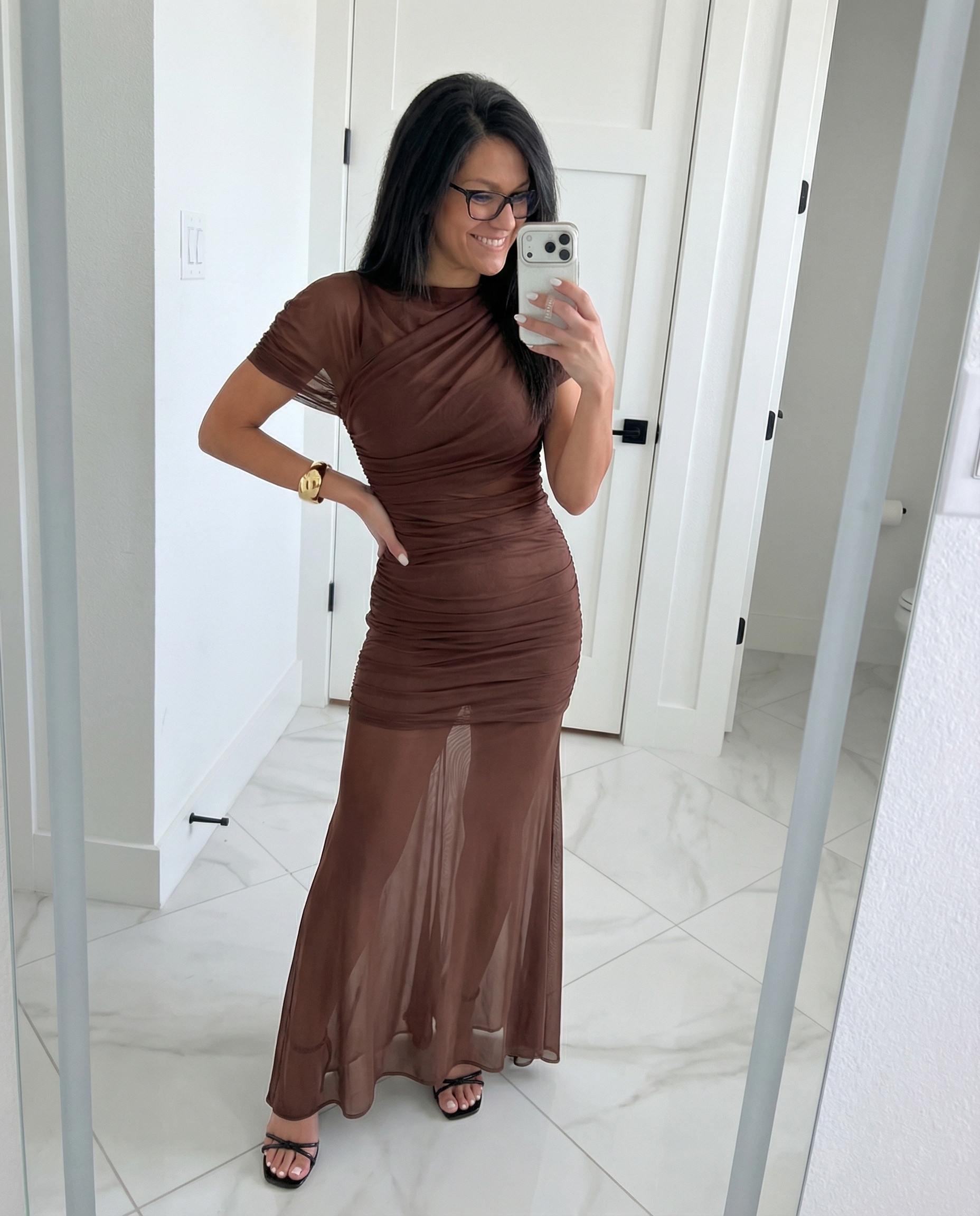 This brown mesh maxi is EVERYTHING. The ruching is so flattering and the sheer hem gives it that extra something. Dressed it up with black strappy heels and a gold cuff — date night sorted. Linked everything in my LTK! 🤎
 

 #LTKgrwm #LTKootd #LTKPetite