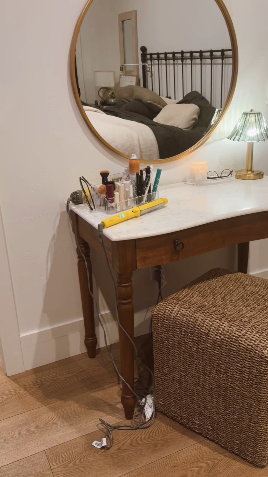 Looking to give your daily routines a 🌟glow up 🌟 in 2026? Me too!

After discussing a client’s vanity needs for a project, I realized that I hadn’t had a proper vanity since I lived in my parents’ house!

Combining a gorgeous Pottery Barn writing desk, an old gold mirror and a spare cube (the most versatile furnishing piece ever) with a few vanity organizers from Target gave me a dedicated dressing table in my bedroom and it has totally upgraded the way I experience doing my hair and makeup.

If you’re still standing up to get ready, I definitely recommend looking for some pieces you can repurpose in your home to give this styling combo a try.

It feels luxurious, put together, and is exactly the kind of romanticized daily space I’m showing up for this year.

Next I’ll work on making my bed. 

#bedroomdecor #vanitytable #grwm #writingdesk #target #potterybarn #rechargablelamp

#LTKmorningroutine #LTKBeauty #LTKHome