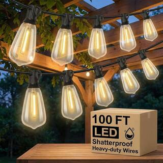 Nordic Hygge 100 ft. LED Outdoor String Lights Plug-in with 52 Shatterproof ST38 Vintage Edison B... | The Home Depot