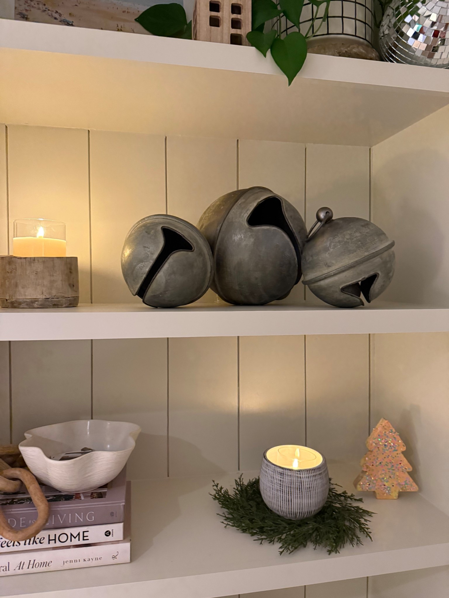 Cozy Christmas shelves activated ✨ Neutral holiday decor, oversized metal jingle bells, warm timer and battery operated candlelight, a tiny Shay made cookie-tree moment… all the simple festive touches I’m loving this year. Grabbed rhe bells from my fav local boutique @thelifestyledco but found some alternatives, my obsession with these candles is real, and will let you know when I decide on the perfect ribbon to add to them for a pop of color! #holidaydecor #neutralchristmas 

#LTKSeasonal #LTKHoliday