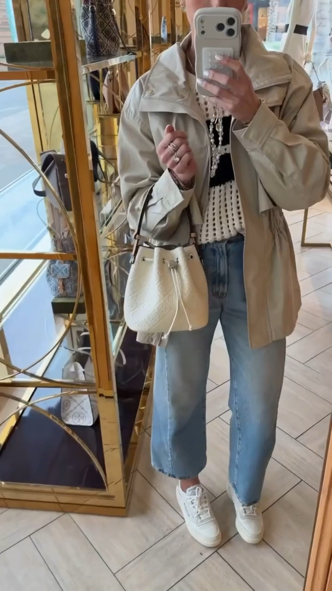 Tory Burch bucket bag on sale, 25% off. Jeans and sweater, 25% off.

#LTKOver40 #LTKSaleAlert