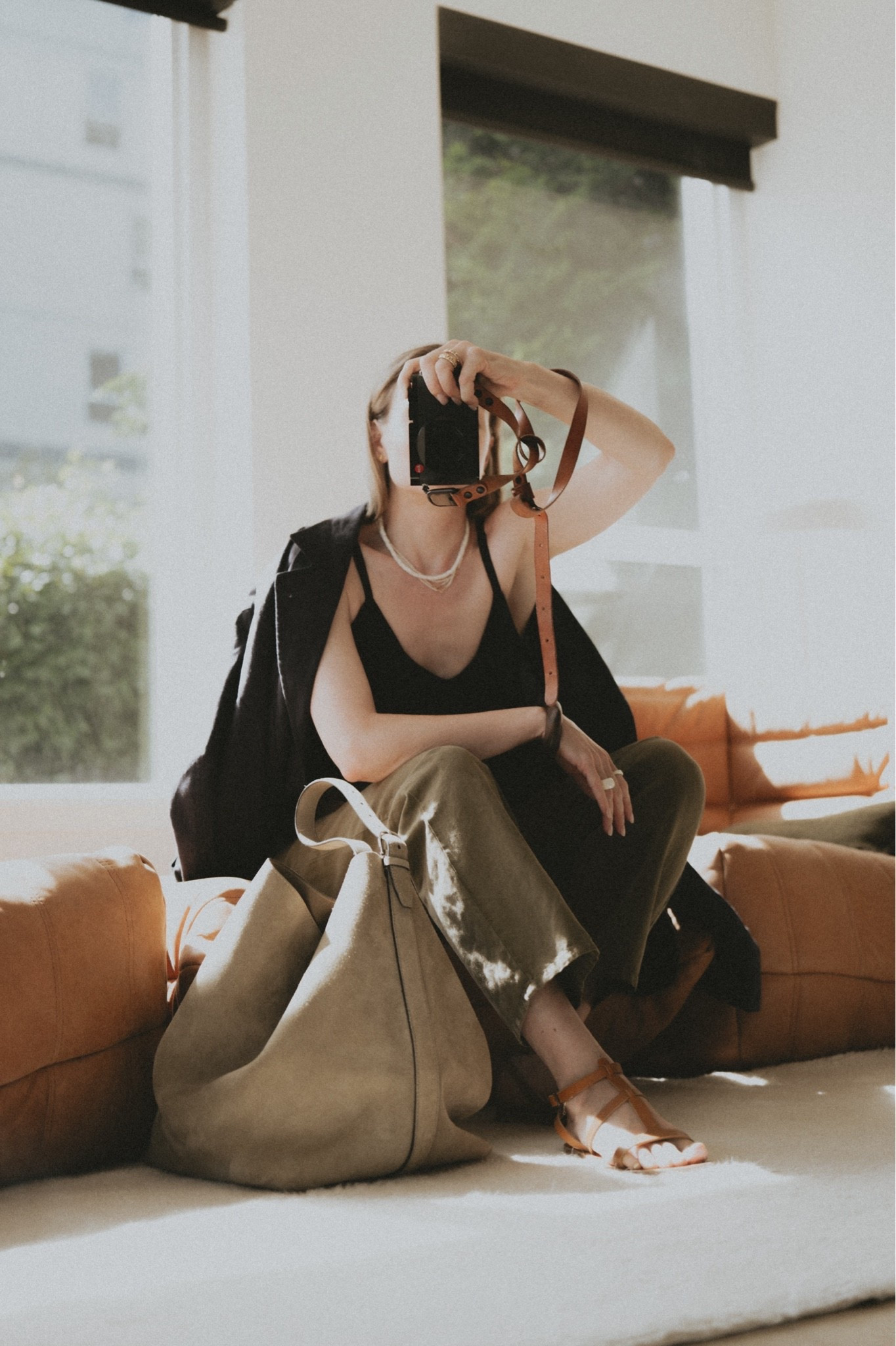 Outfit idea: linen and silk for chilly mornings and hot days
Blazer: Buck Mason linen blazer borrowed from the husband 
Cami: older Banana Republic 
Sandals: K. Jacques St. Tropez
Pants: Nili Lotan Shon
Bag: Toteme belted tote in suede
Jewelry: @Mejuri & @Etsy

#LTKootd #LTKSeasonal #LTKWorkwear