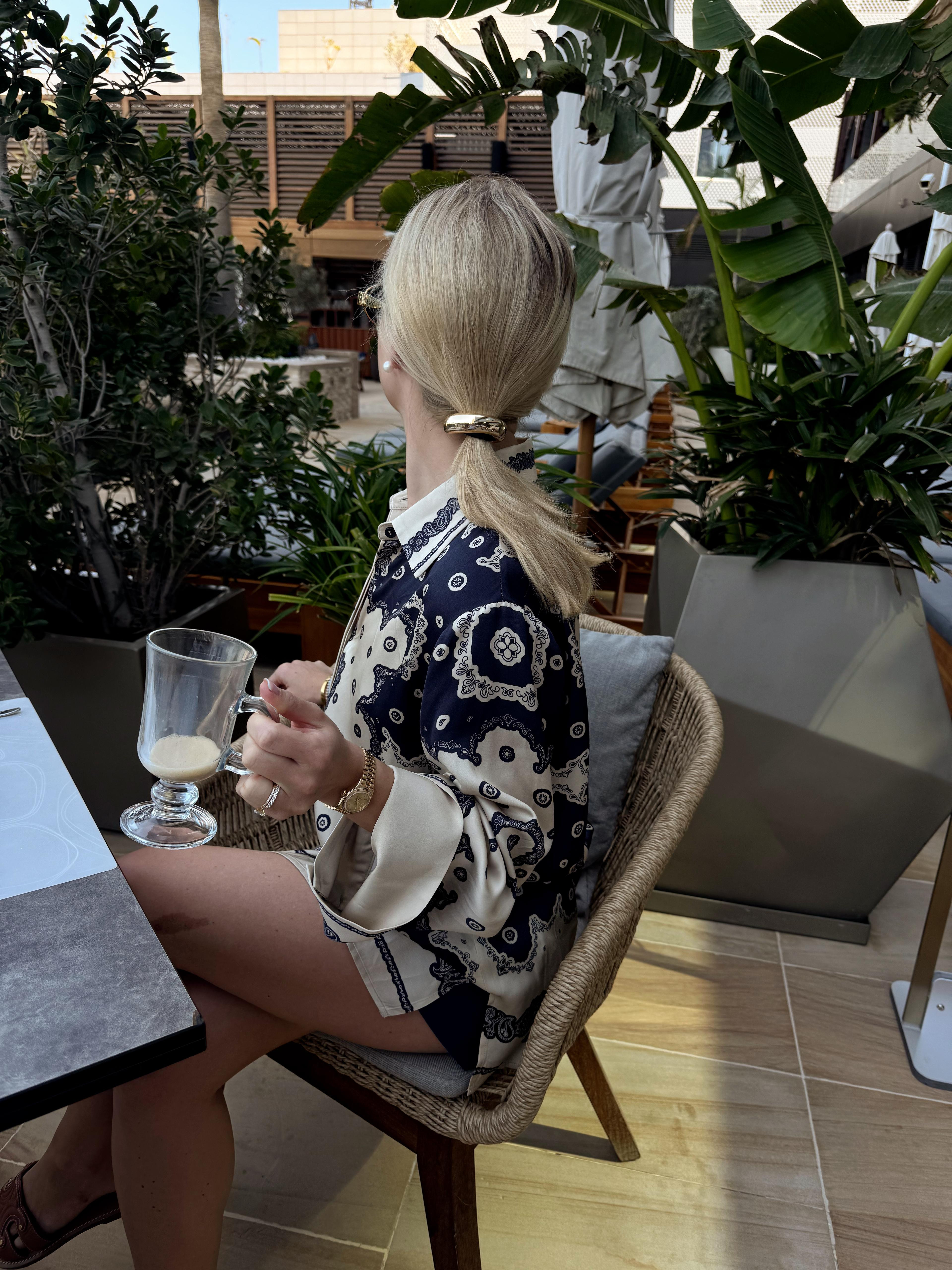 Holiday outfit ideas, Malina shirt, gold cuff hair tie, Anisa Sojkar hair tie, hair accessories, paisley shirt, designer fashion, gold accessories, summer shirt, winter sun outfit, Dubai outfit  

 #LTKuk #LTKluxury #LTKstyletip