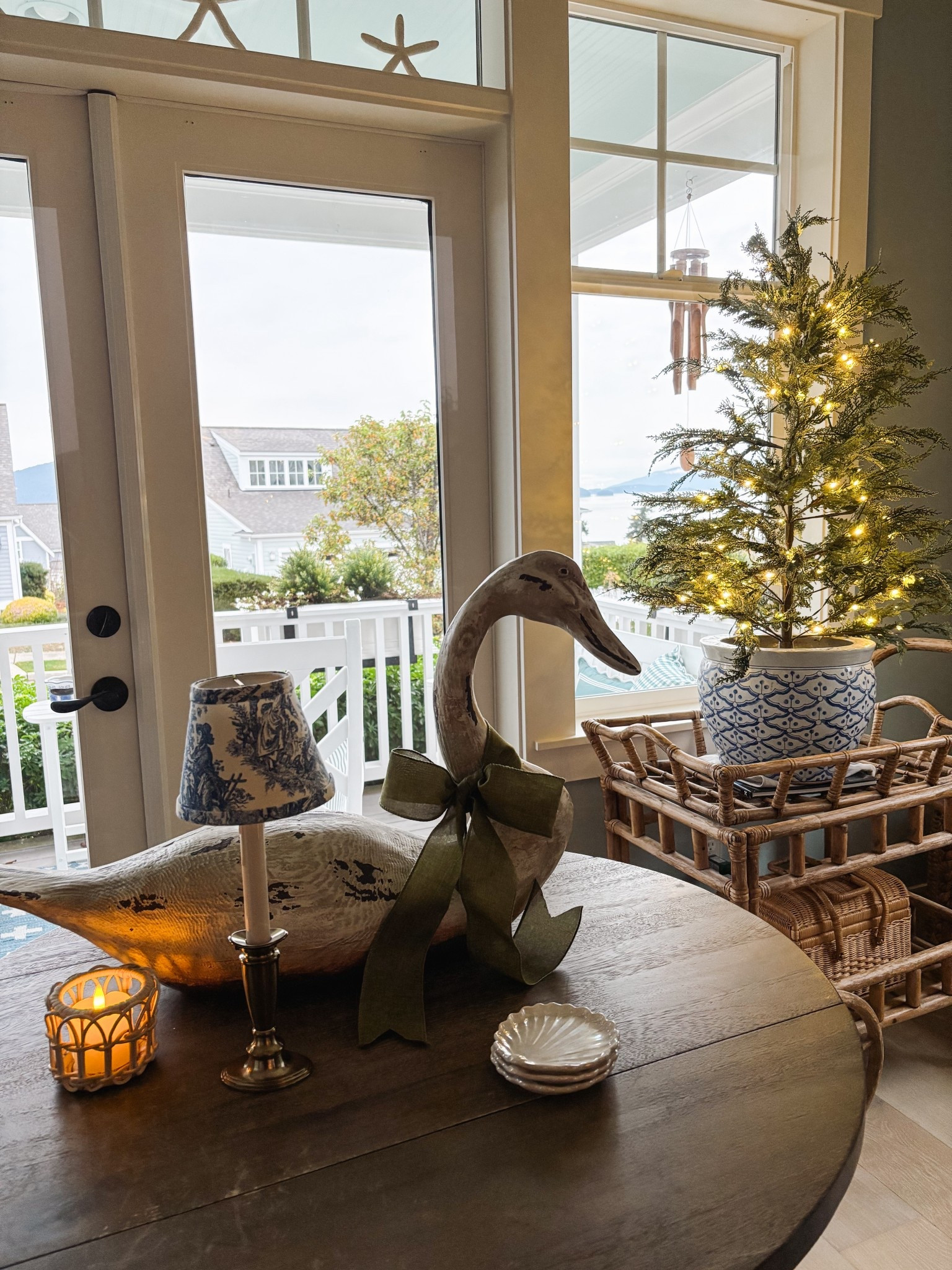 Window candle, blue and white toile lampshade, twinkling light tree, ribbon on swan, rattan tealight holder

#LTKHoliday #LTKHome #LTKSaleAlert