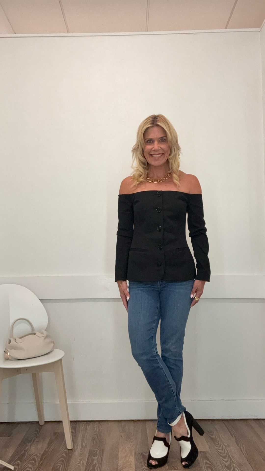 Chic elevated fall outfit in this black sleeveless blazer top. Work with a Parisian designer gold with black stones chain necklace and Parisian gold stop earrings. Ring is by Agape (French designer). High heel loaders are old by Rachel Roy. Top wearing size 2. If between sizes, size down. Denim fit true to size.