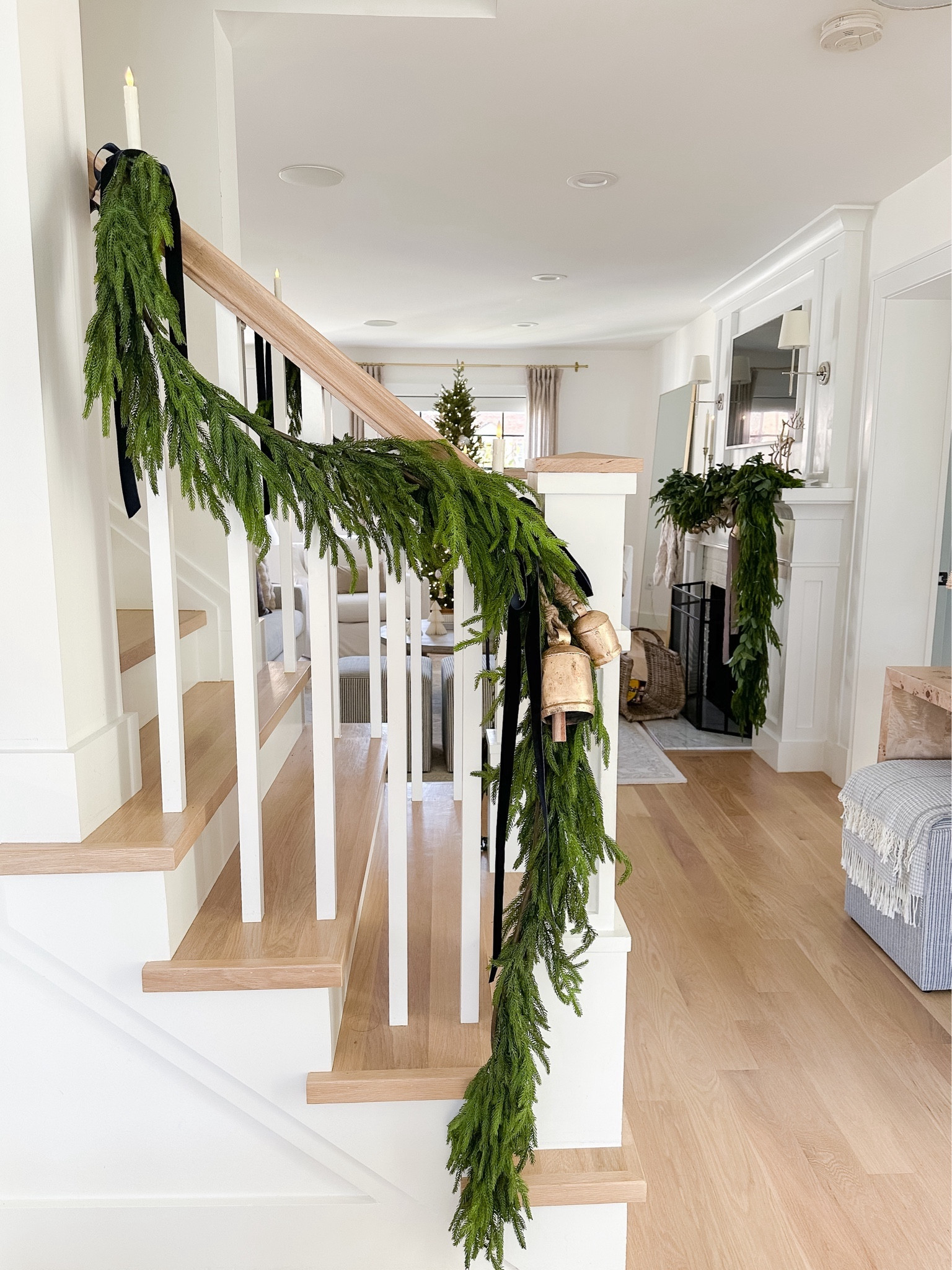 Norfolk Pine Garland brass Bell’s navy velvet ribbon clip on pottery powered candles. Christmas garland on stairs.

#LTKHoliday #LTKstyletip #LTKSeasonal