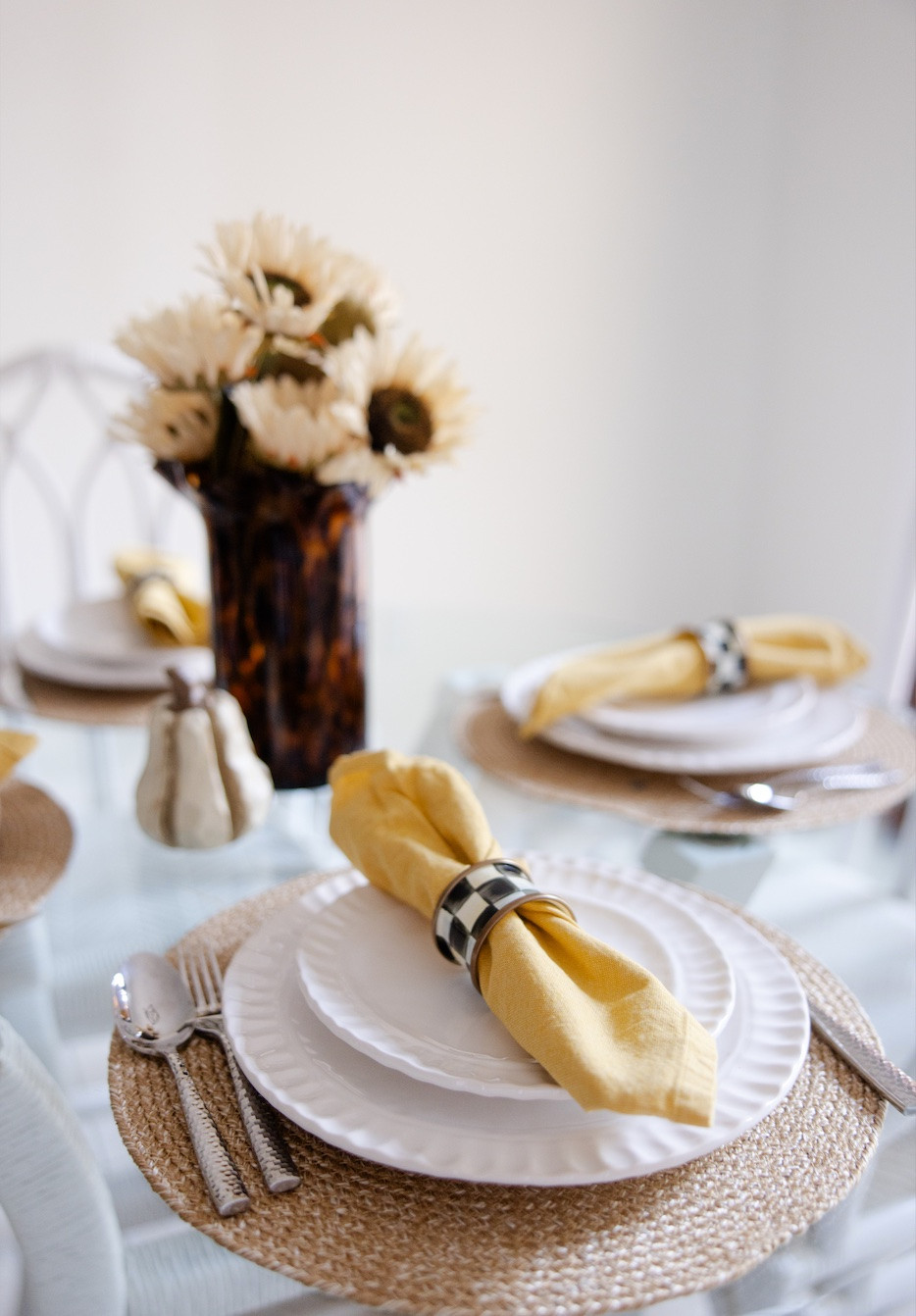 ⁠Southern charm meets autumn elegance 🍂✨ ⁠
⁠
This is a simple and cozy fall tablescape featuring crisp white plates, gold linen napkins, a statement tortoise vase, and a touch of black & white flair. ⁠
⁠⁠
#SouthernStyle #FallEntertaining #TablescapeGoals #mckmichcollective #motherddaughterblog #southernhome⁠ #mackenziechilds 

 

#LTKSeasonal #LTKHome #LTKSaleAlert
